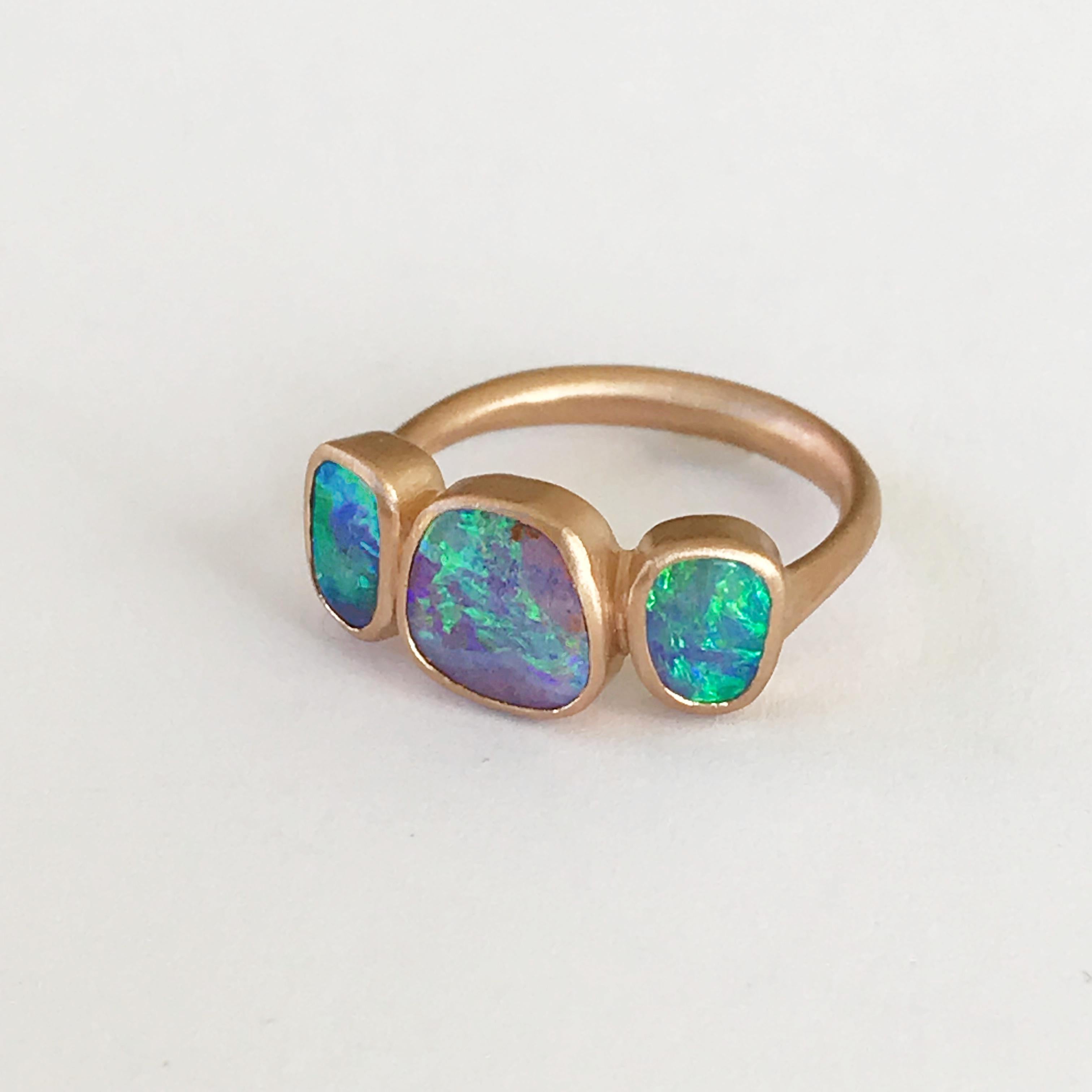 Dalben design One of a kind 18 kt rose gold ring with three bezel-set blue-violet-green Australian Boulder Opals weight 2,68 carats  .  
Ring size  US 7 1/4  - EU 55 re-sizable .  
Bezels setting dimension:  
max width 20,2 mm,  
max height 8,9 mm.