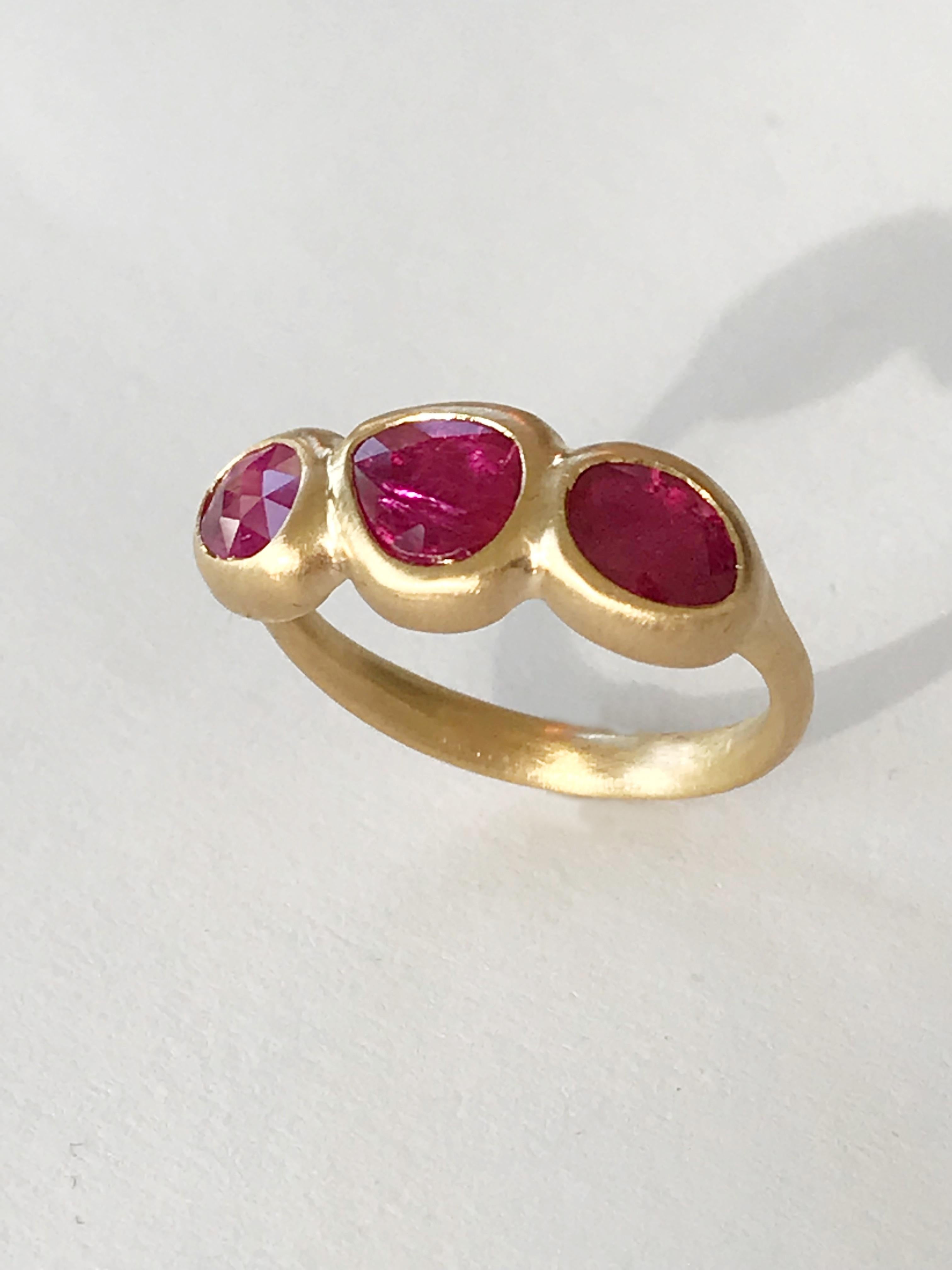 Dalben design One of a Kind 18k yellow gold matte finishing ring with 3 bezel-set rose cut slice ruby total weight 1,4 carat . 
Ring size 7 USA - EU 54 re-sizable to most finger sizes. 
Bezel stone dimensions :
height 8,5 mm
total width 21 mm
The