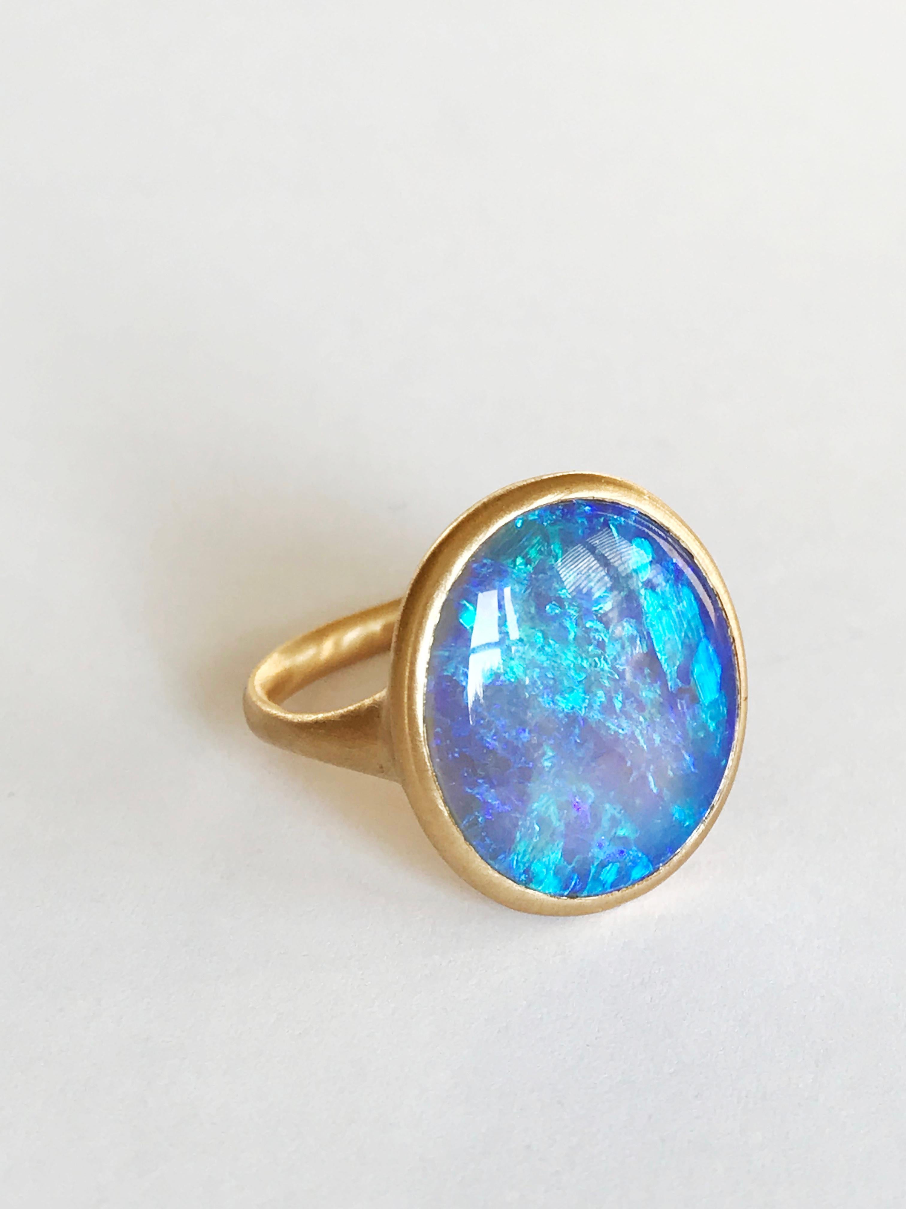 Dalben design One of a kind 18 kt yellow  gold ring with an oval cabochon solid Australian Crystal Opal weight 5,64 carats from Coober Pedy  .
The opal has  wonderful blue green reflex especially at sunshine 
Ring size  US 7 1/4   -  EU 55