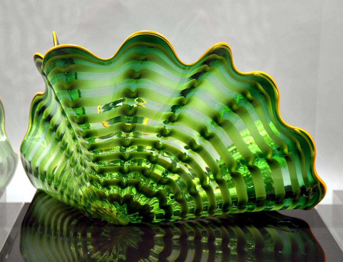 The American glass sculptor Dale Chihuly is well-known for his innovative techniques for creating handblown glass sculptures. His glass practice is a departure from traditional symmetrical and perfectly formed vessels. Instead, his works embrace