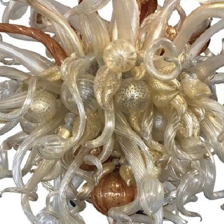 Artist: Dale Chihuly 
Provenance: We have a copy of the original 6 page sales contract between Chihuly and the buyer
Piece; Gilded Silver and Gold Ice Chandelier with Ruby Accents, circa 2004 
Medium: Hand-blown Glass 
Size: 5' x 4' 
250 piece