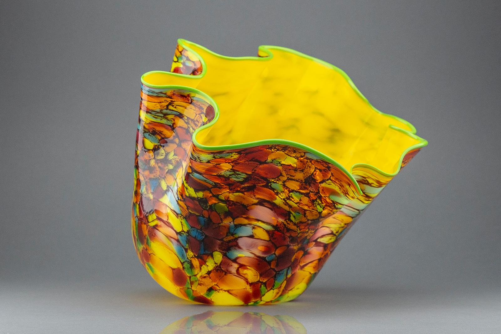 Artist: Dale Chihuly
Title: Carnaval Macchia large vase with Yellow Interior
Medium: Handblown glass vase
Size: Measures 9.5