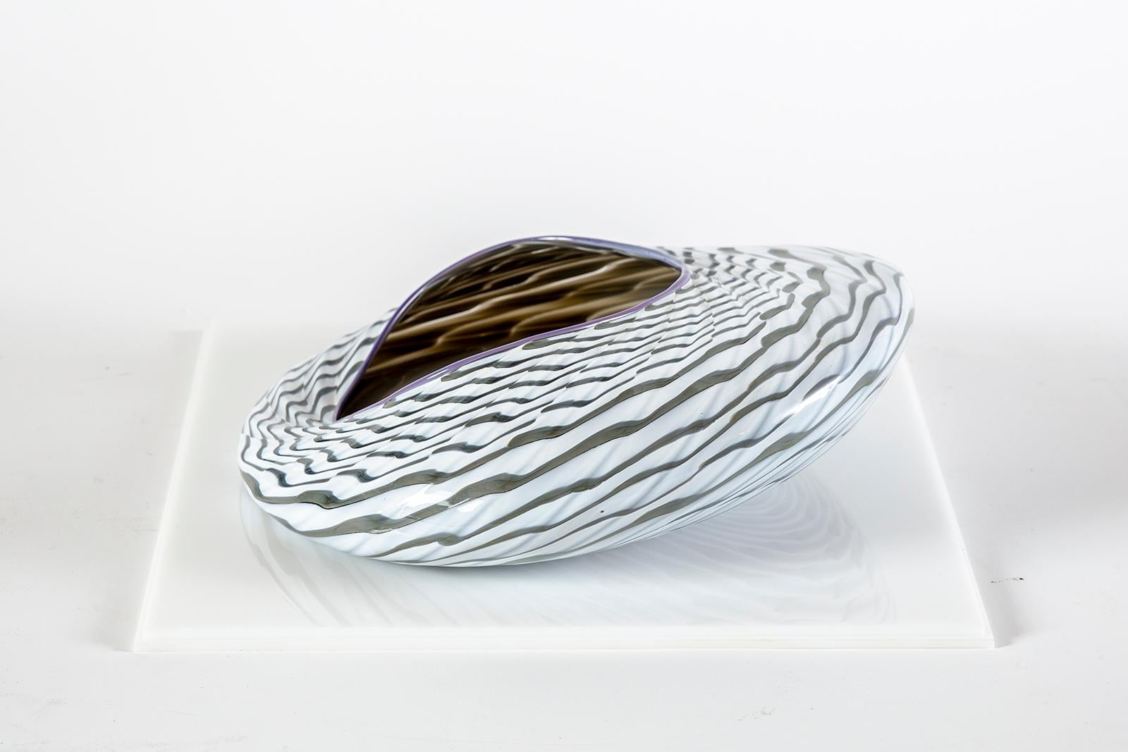 Dale Chihuly – Sea Form Bowl, 1984
Hand-blown Glass
Size: 12 inches
Signed and dated by the artist
Condition: Mint
Certificate of Authenticity included

With each of his series, Dale Chihuly pushed the glass making process to its limits. Evolving
