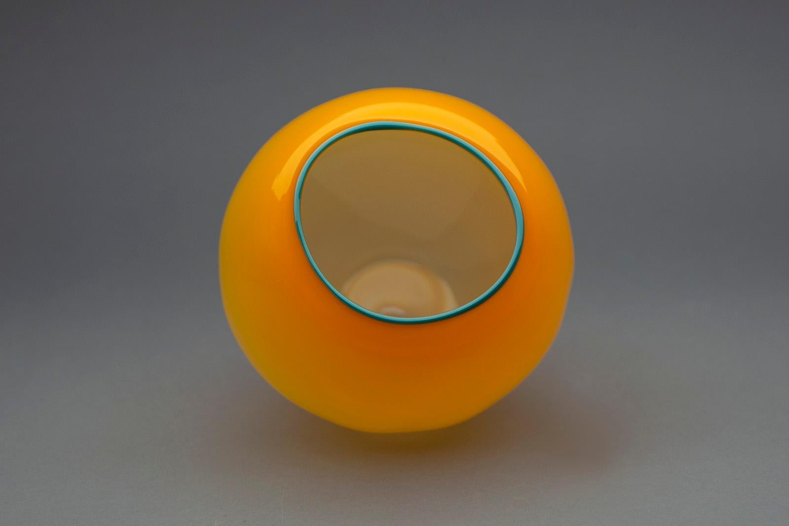Artist: Dale Chihuly
Title: Mango Basket with teal Lip Wrap
Medium: Hand Blown Glass
Size: 7