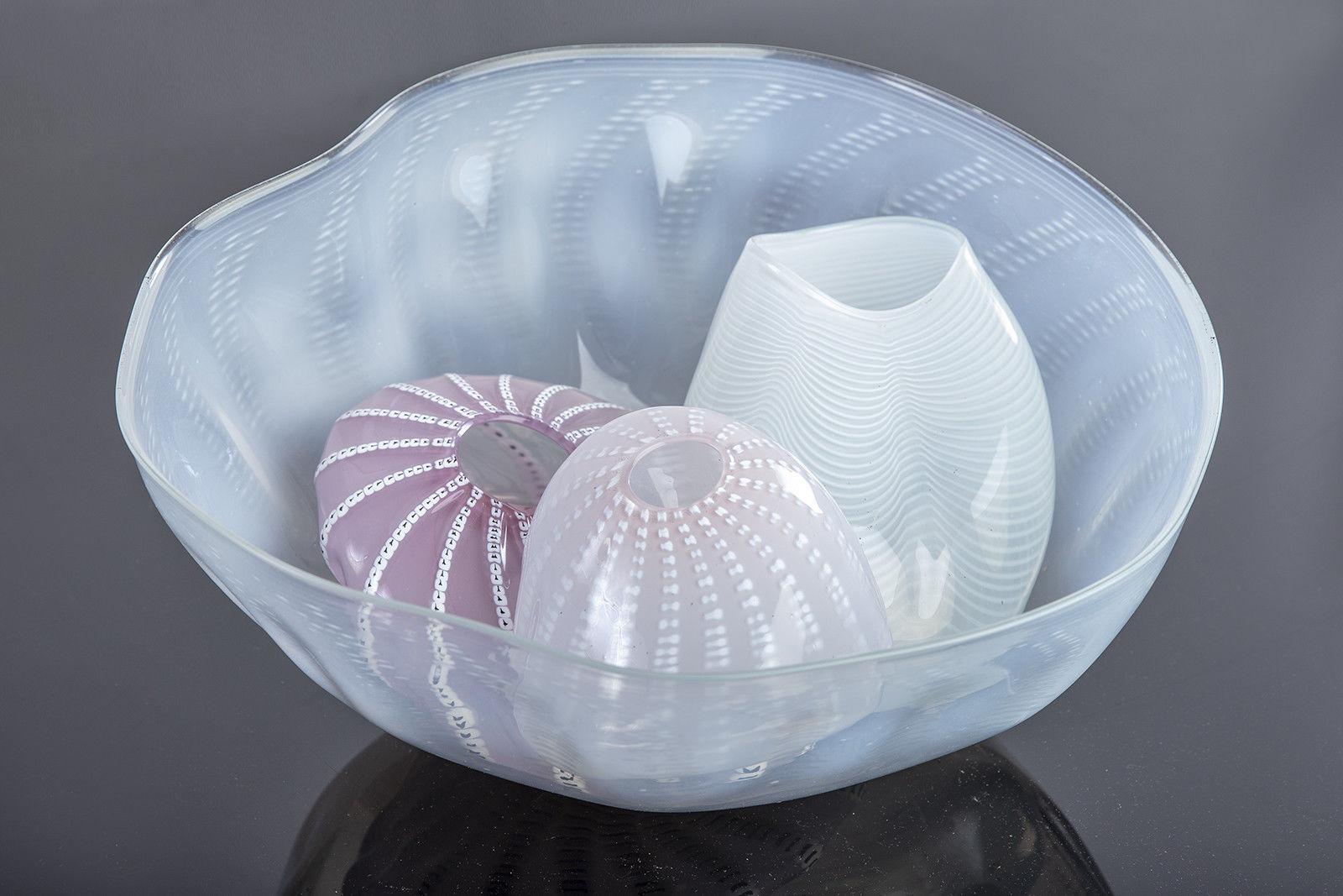 Artist: Dale Chihuly
Medium: Hand Blown Glass
Size: Largest 8" x 15 3/4"
Year: 1980
Signed: Inscribed by the Artist and Dated
Condition: Museum Quality Condition
Provenance: Gallery COA

Inspired by Northwest Coast Indian baskets he sees at the