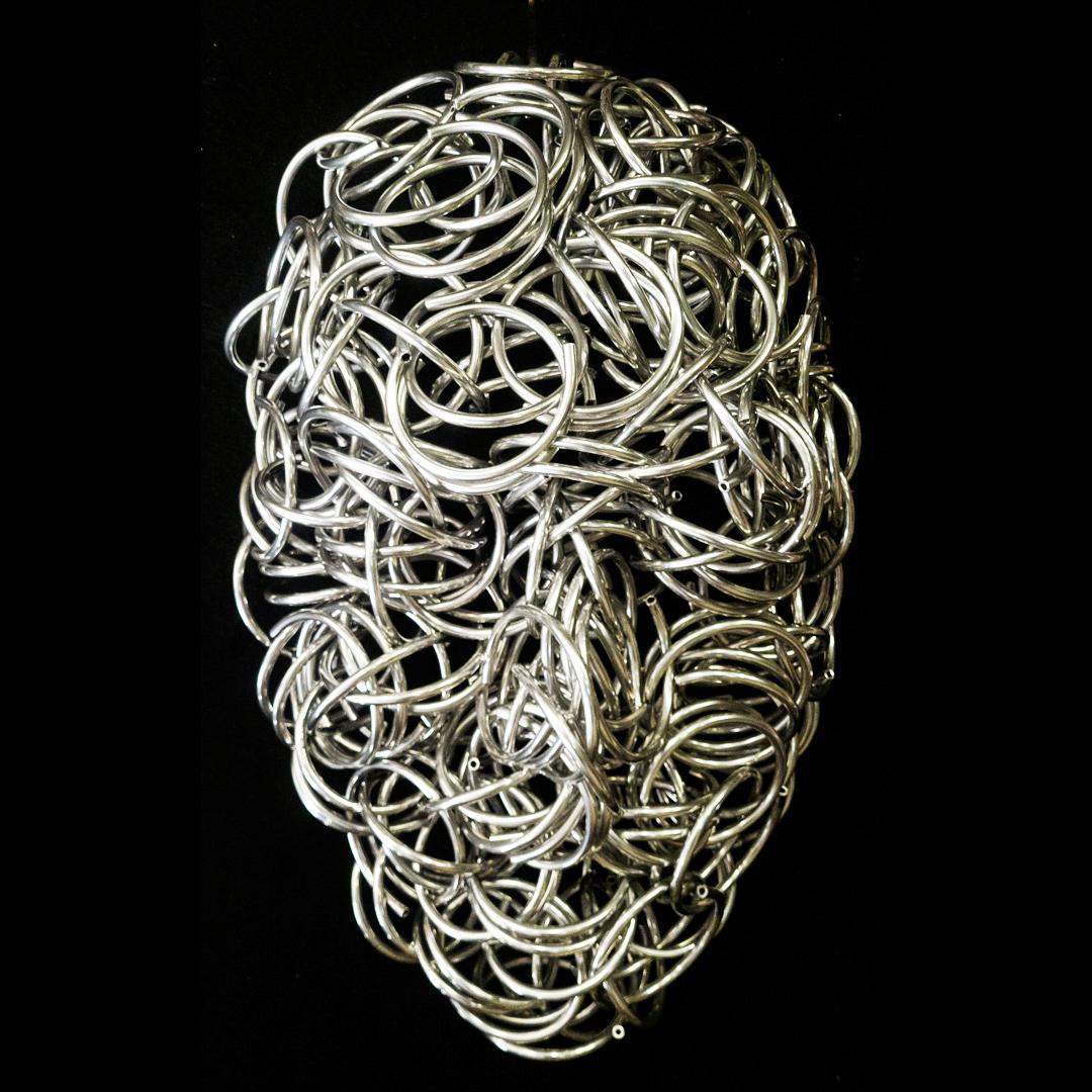 Primavera - contemporaneo, figurativo, maschera, alluminio, cromo, scultura da parete - Sculpture di Dale Dunning