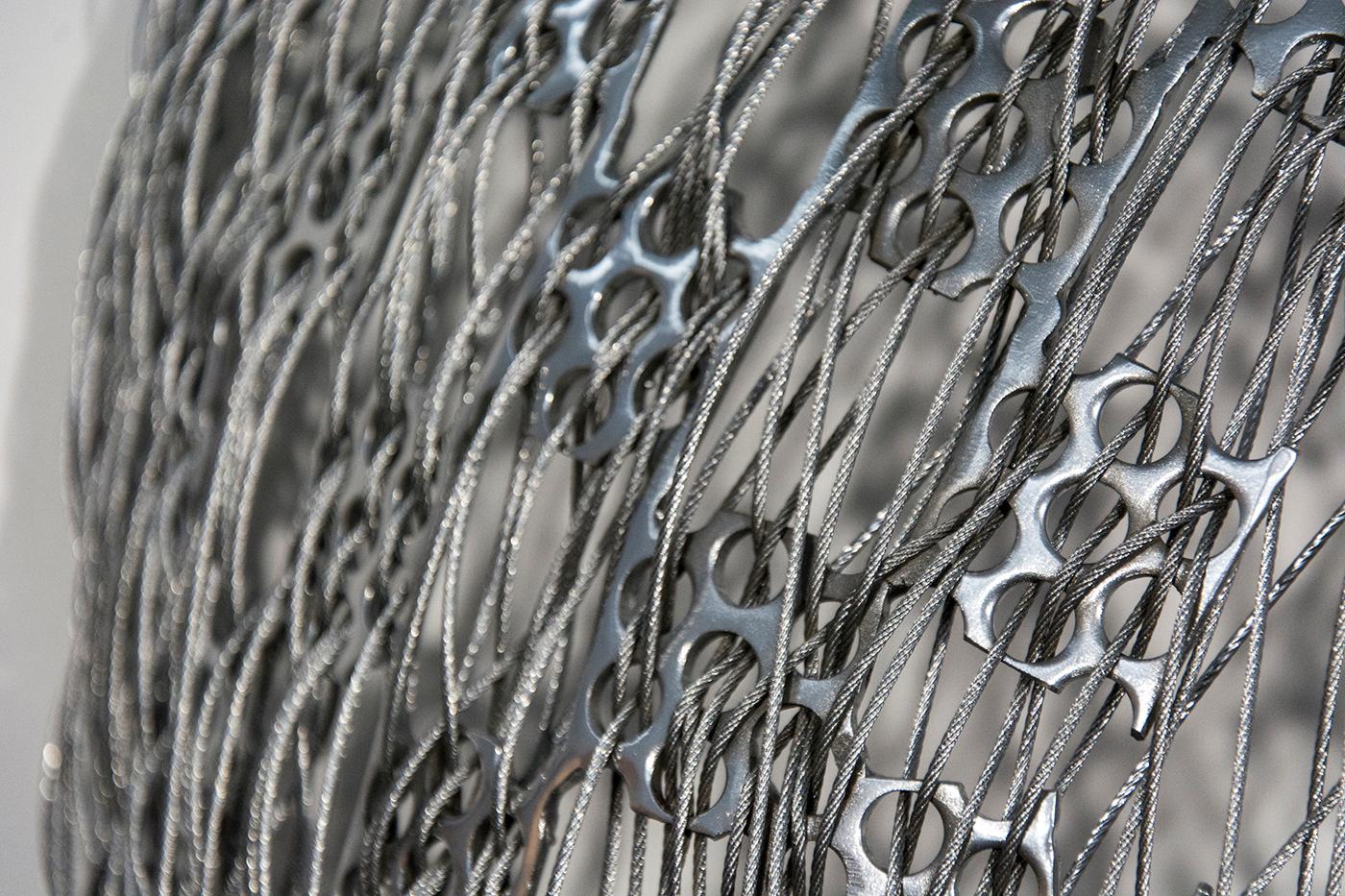 Tangled - silver, abstract human face, stainless steel and cable wall sculpture - Gray Figurative Sculpture by Dale Dunning