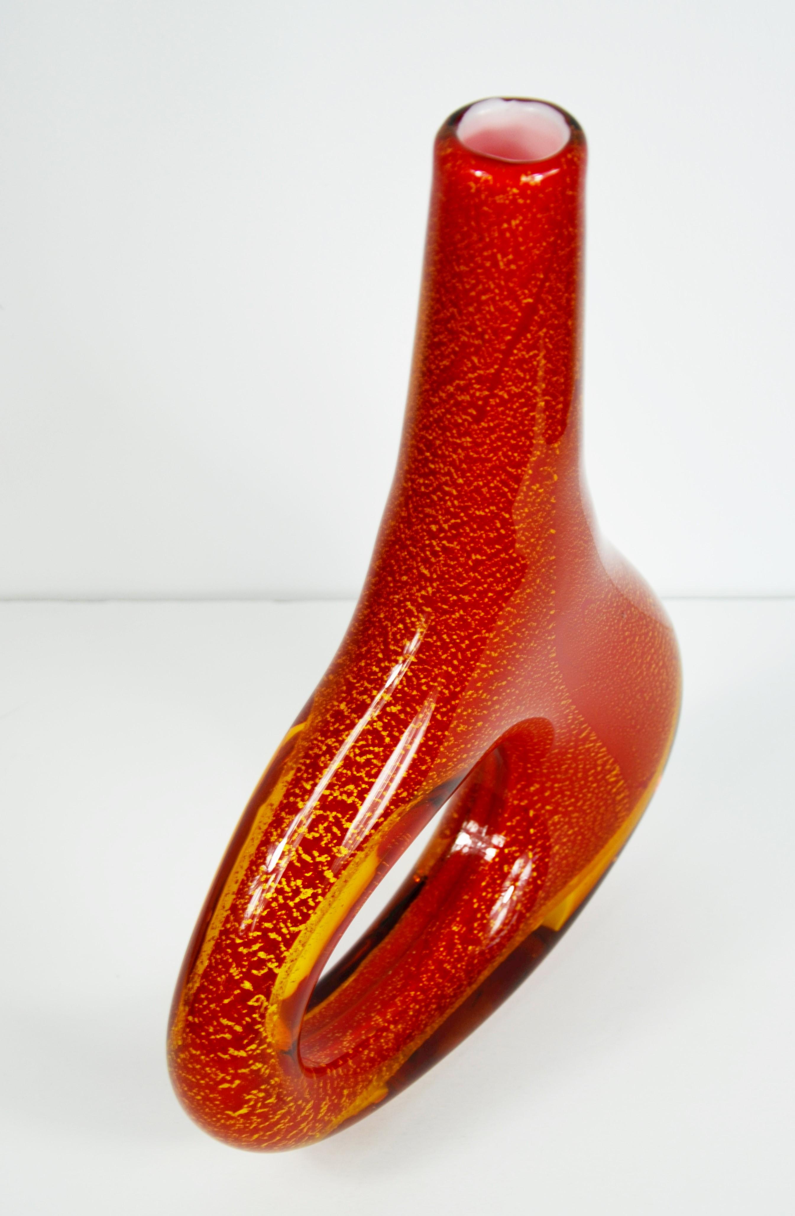 Offered is a signed Dale Tiffany orange red with gold fleck organic in shape blown art glass vase. This piece is more art glass than functional glass vase. The depth of the colors in the blown glass is quite unique and beautiful. We suggest