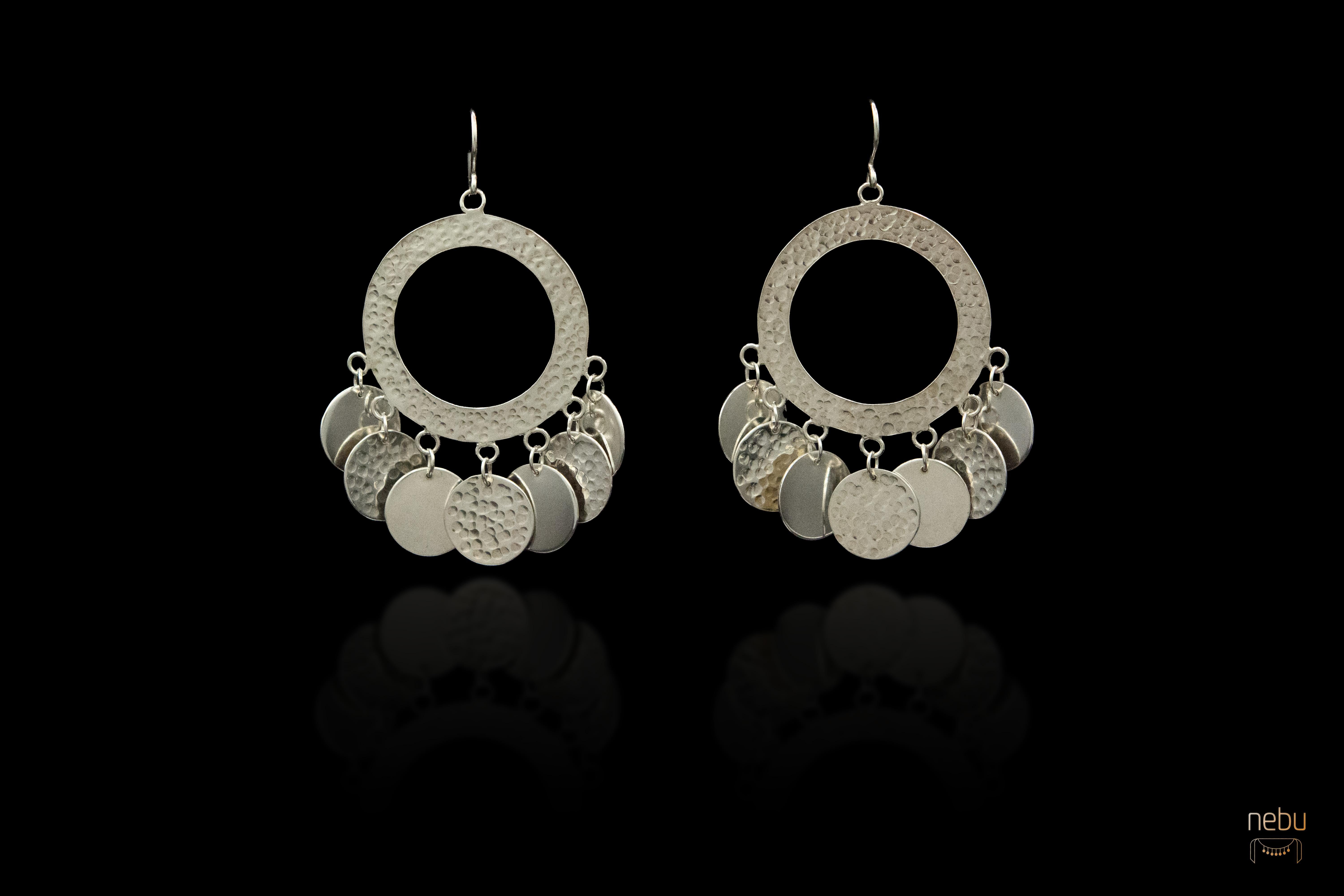 - Available.
-Handmade
- Sterling silver 
- Stamped with Nebu logo

Imbued with passion and crafted with care, these earrings are meticulously handmade in sterling silver, each pair a testament to the enduring legacy of the iconic singer, Dalida.