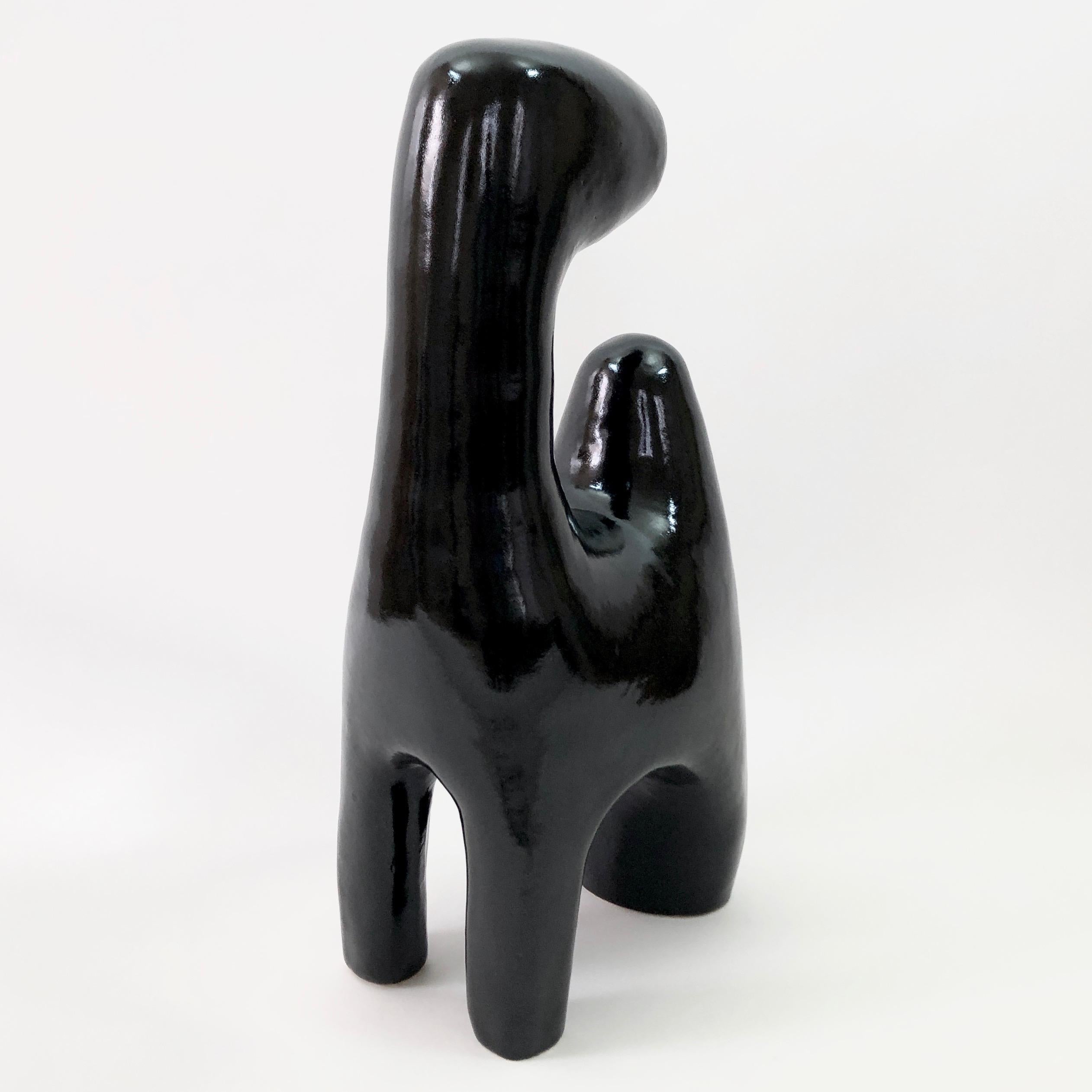 Important biomorphic sculpture, abstract or stylized animal shaped, ceramic enameled in glossy black. 
One of a kind handmade piece, signed and numerated by the French artists and ceramicists: Dalo.
 