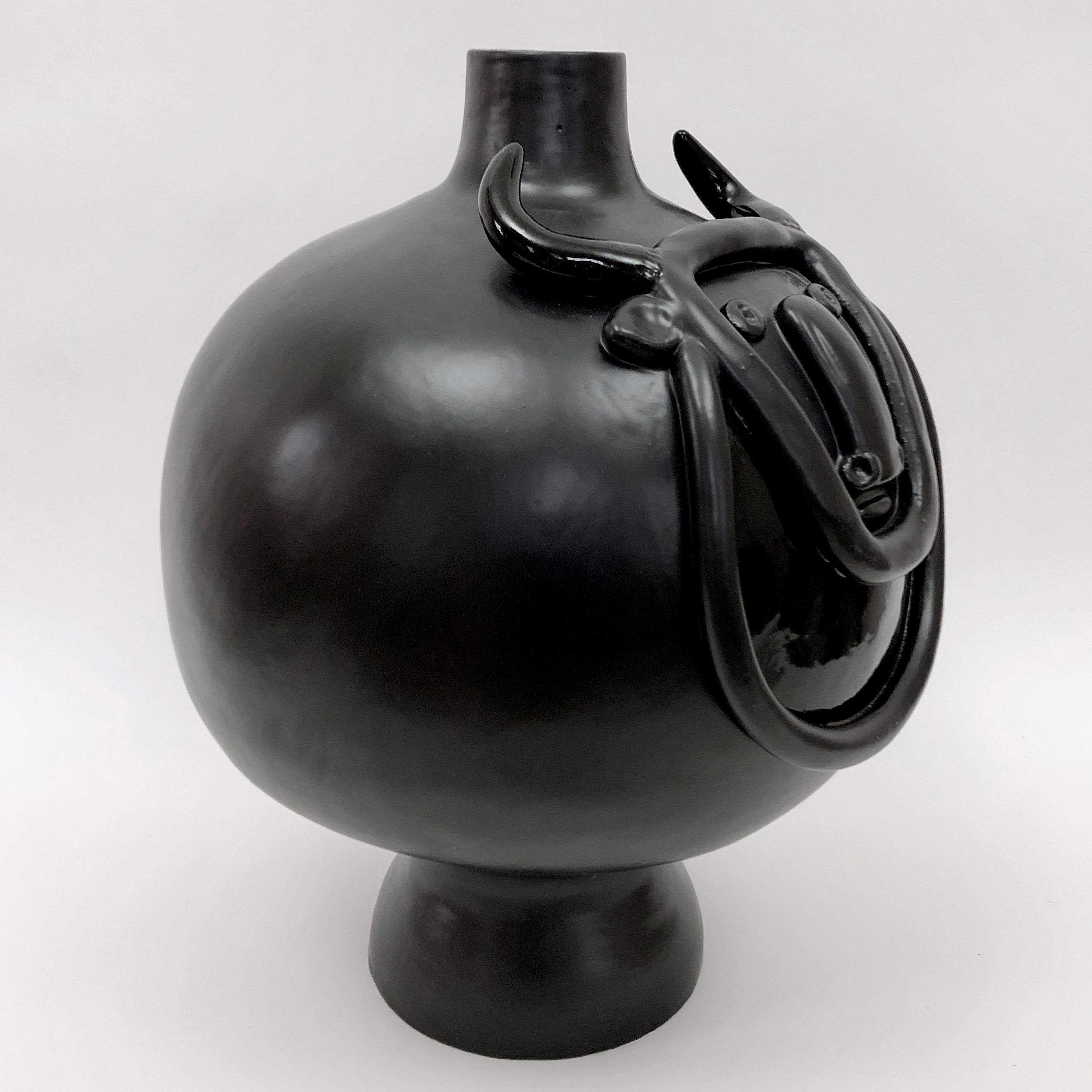Important sculpture, forming a table lamp base.
Ceramic glazed in matte and glossy black, decorated with a stylized bull face and details sculpted front and back. 

One of a kind handmade piece, signed and numerated by the French artists and