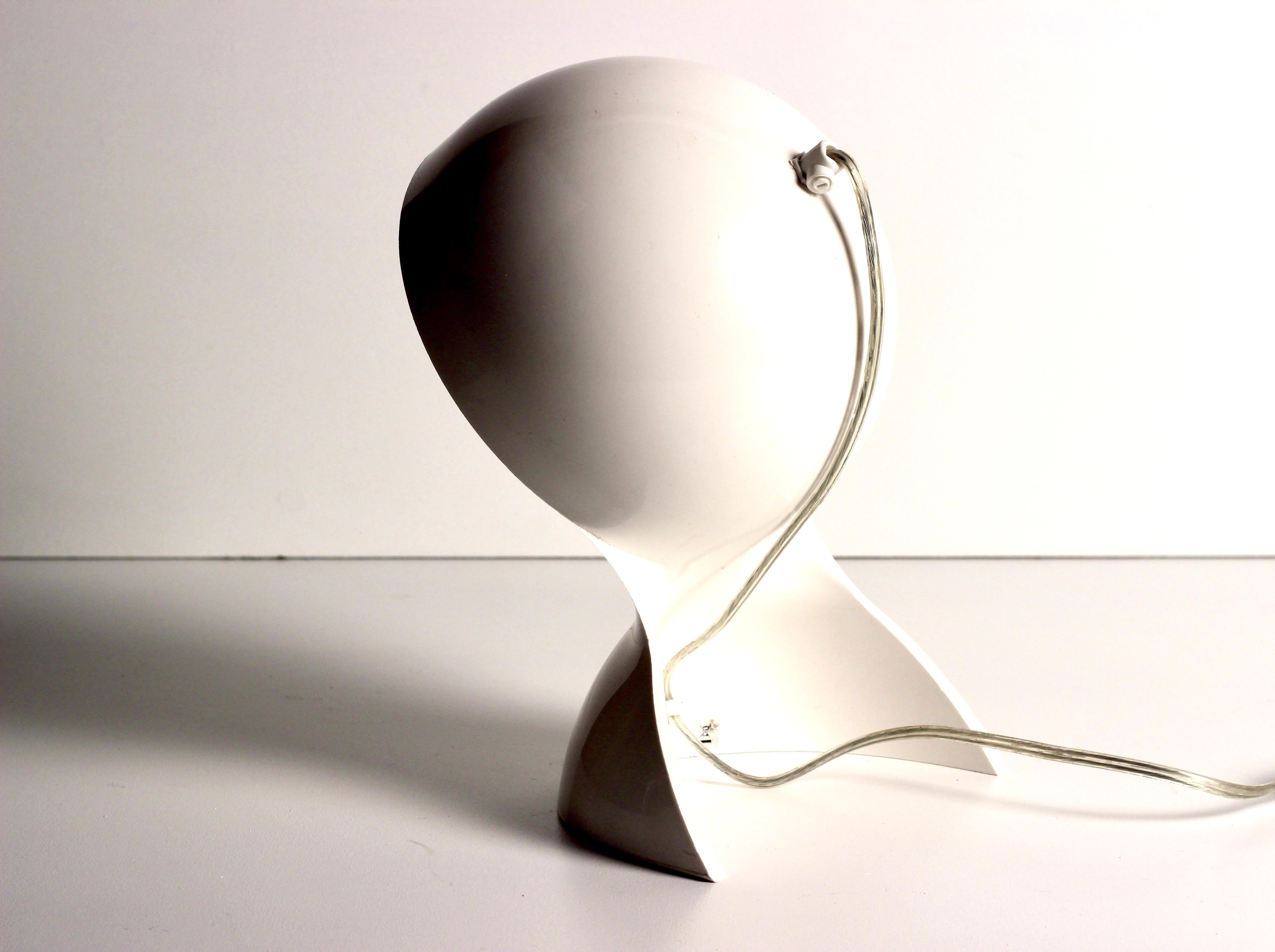 This rare table lamp was designed by Vico Magistretti for the Italian manufacture Artemide during the 1960s, it is one of 2 that we currently have in stock. The lamp is made from one main piece of white plastic. Dalù is one a wonderful expression of