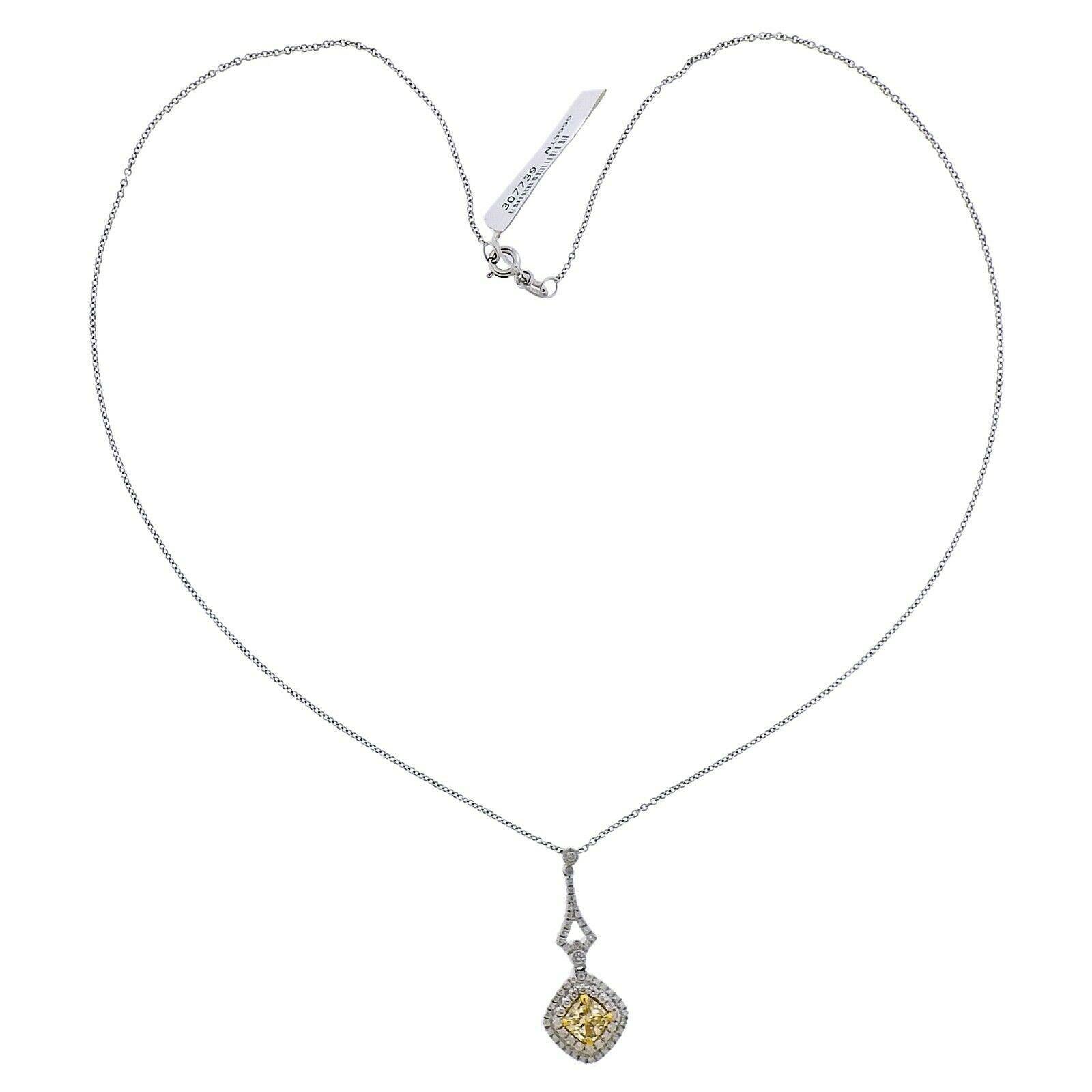 18k white gold pendant necklace by Dalumi. Set with a 1.00ctw VS2 fancy yellow cushion cut center, and 1.40ctw of VS2/H side diamonds. Necklace is 18