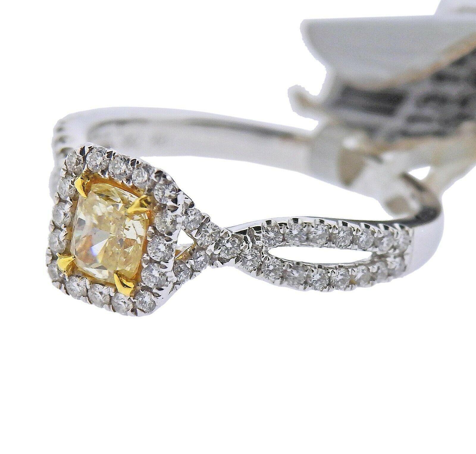 18k White gold ring by Dalumi. Set with a 0.51ctw VS2/ fancy light Yellow diamond, and 0.40ctw of VS2/H diamonds. Ring size - 6.5, ring top - 8mm x 7.5mm. Marked - DG, 0.51ct, 18k, 750.. Weight - 3.4 grams. Retail $6599
