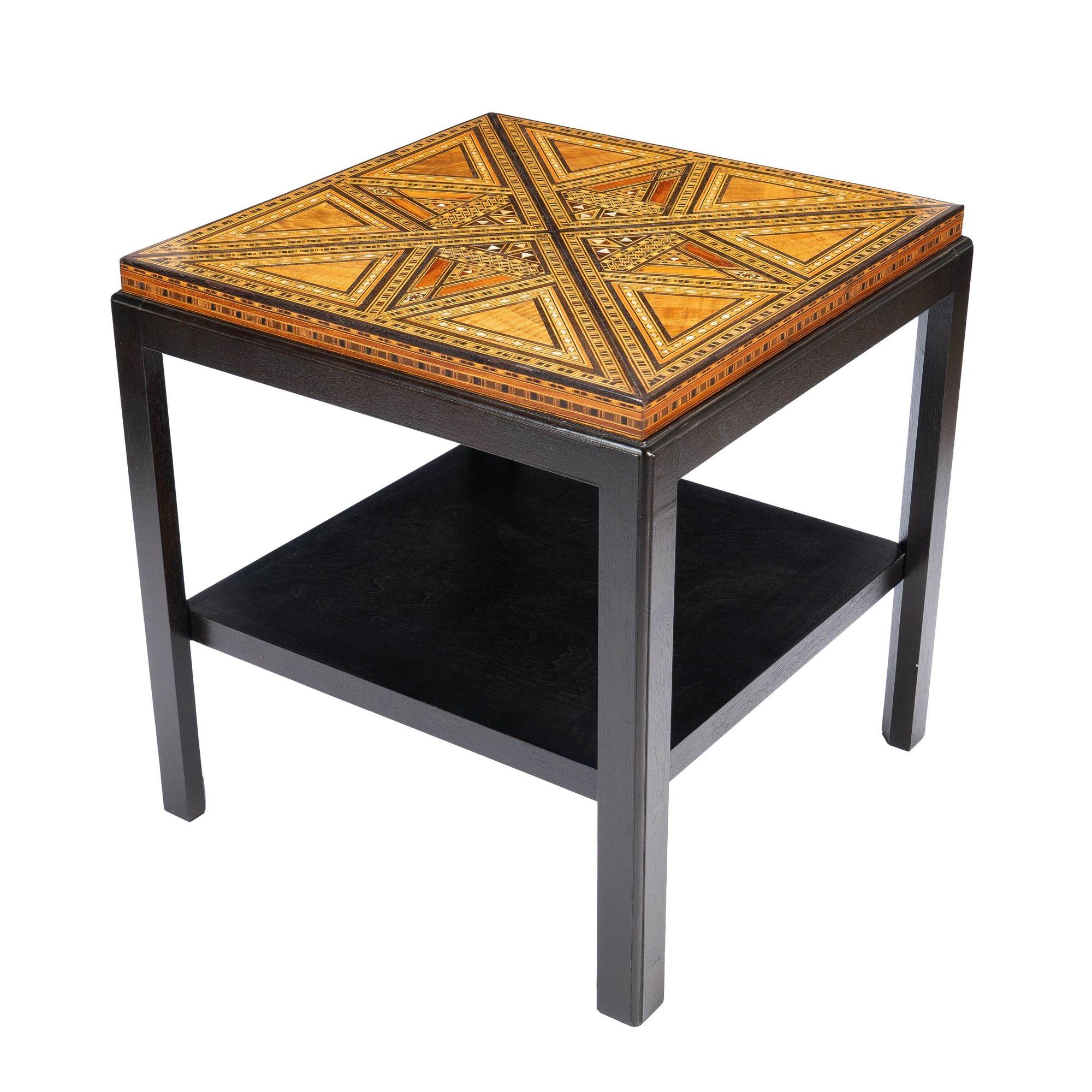 Damascus table top with geometric inlays of mixed hardwoods and Mother-of-Pearl. The table top has been remounted on a custom walnut stand with X stretcher & removable shelf.
Damascus, Syria, circa 1900.