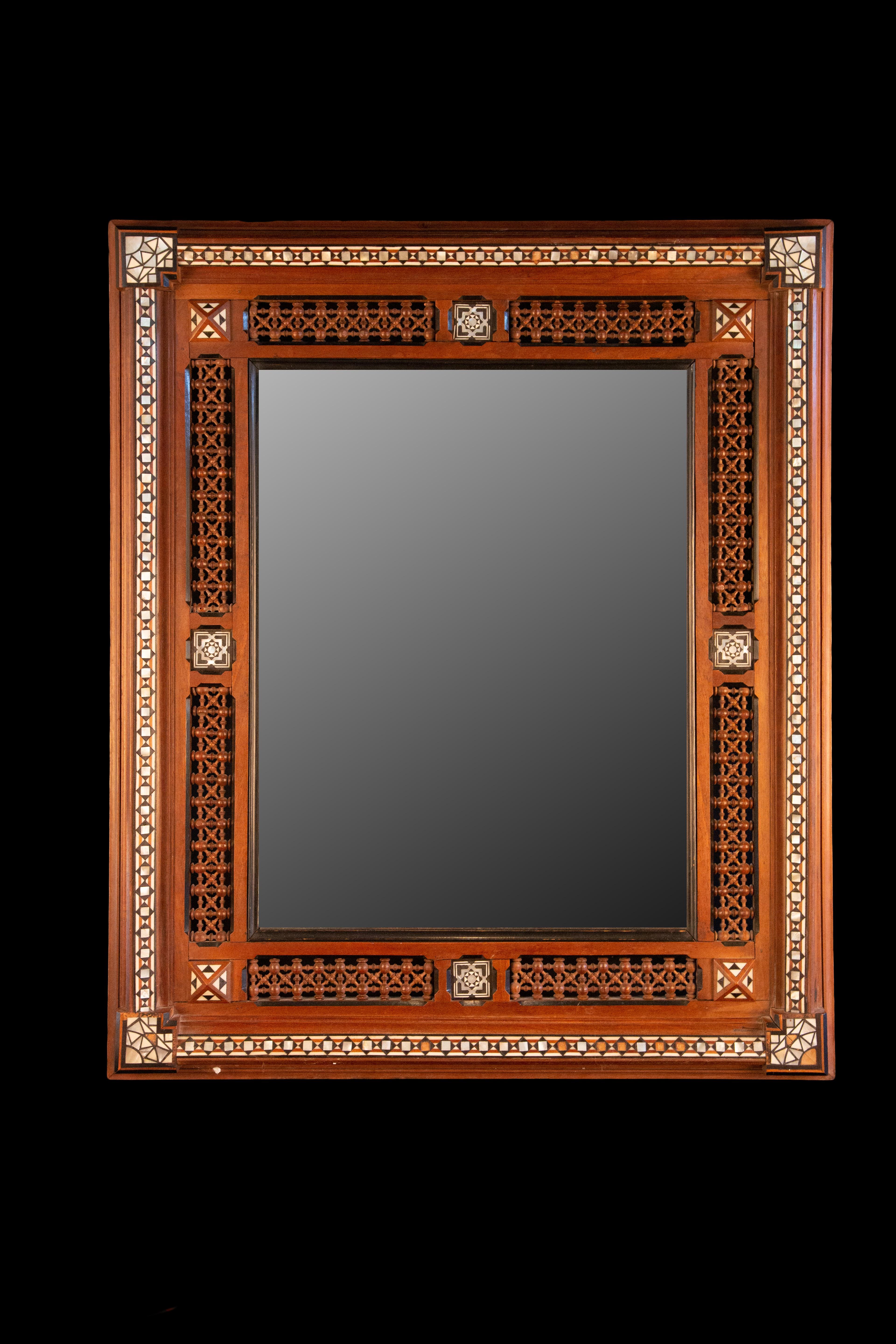 Early 20th Century Damascus inlaid bone and wood wall mirror:

Measures: 25