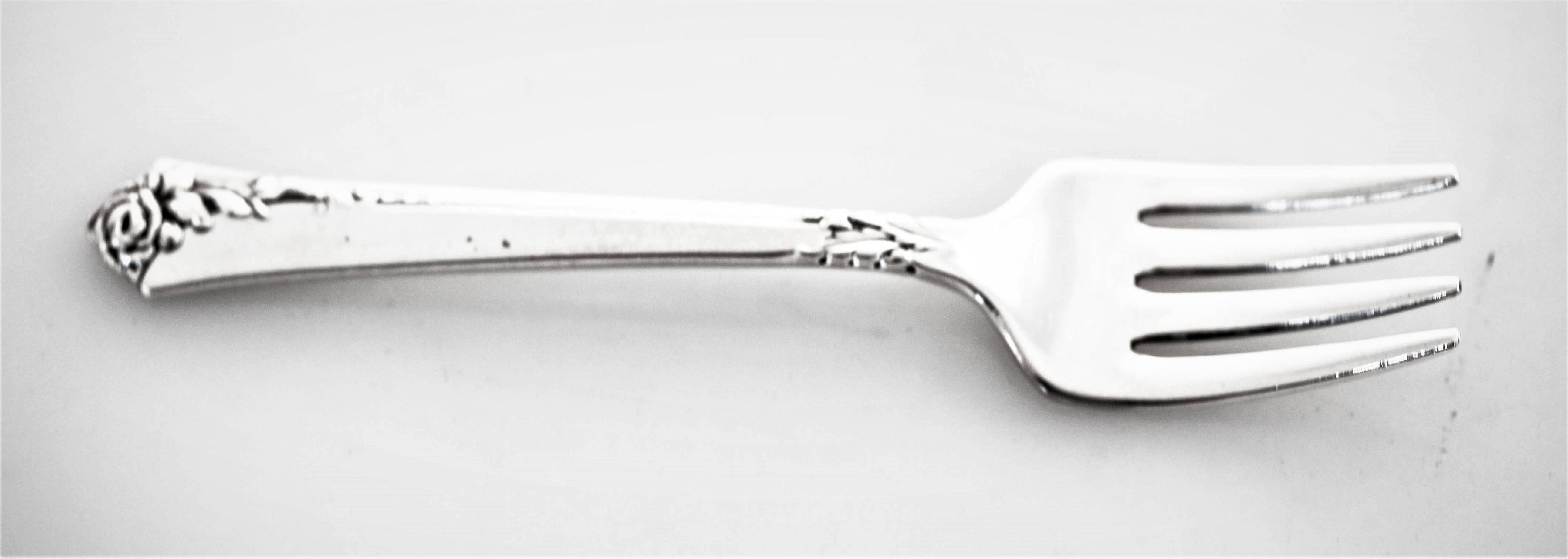 For the new born baby girl (or boy), a lovely fork and spoon set. A gentle rose at the very top with a few leaves beneath it. Give the gift that lasts forever; give them their first piece of silver.
 