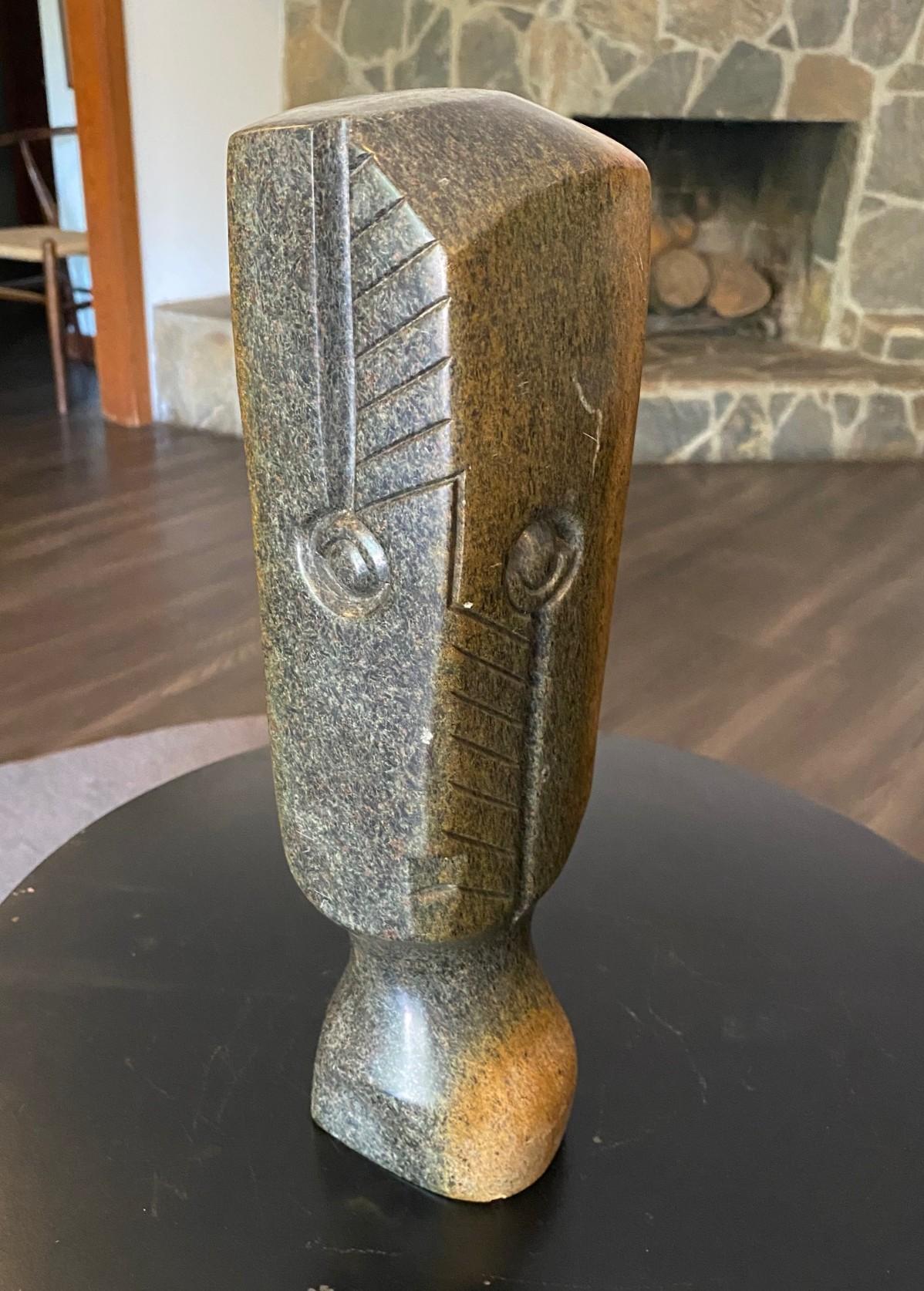 A beautiful, wonderfully executed and designed Shona stone sculpture by renowned African/ Zimbabwean sculptor/artist Damian Manuhwa (1952-2008) who lived and worked in Zimbabwe.  

This piece, which is a little reminiscent of the work by English
