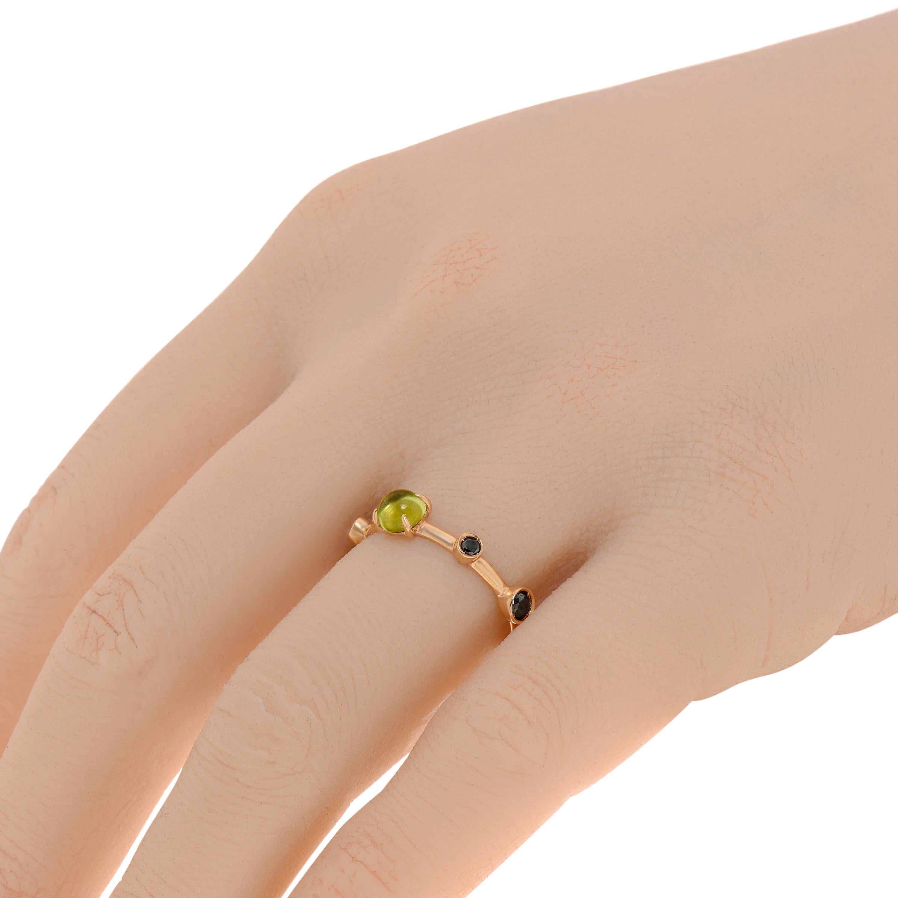 Damiani 18K rose gold gemstone ring features a thin band surrounded with green and black peridot. The ring size is 7 (54.4). The band width is 1.5mm. The total weight is 2.3g.
