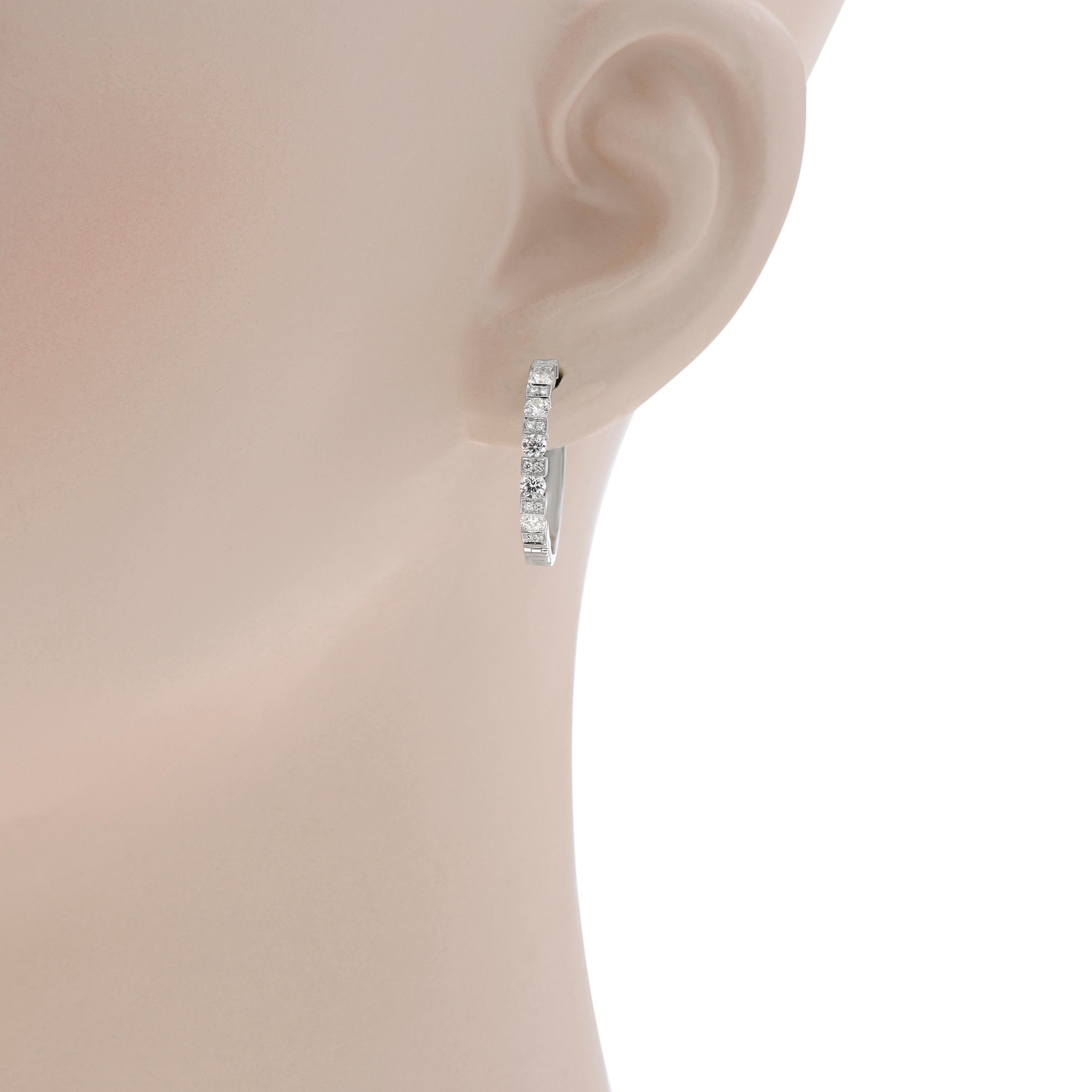 Damiani 18K White Gold Huggie Earrings feature 1.012ct. tw. diamonds set in 18K White Gold. The earring diameter is 3/4
