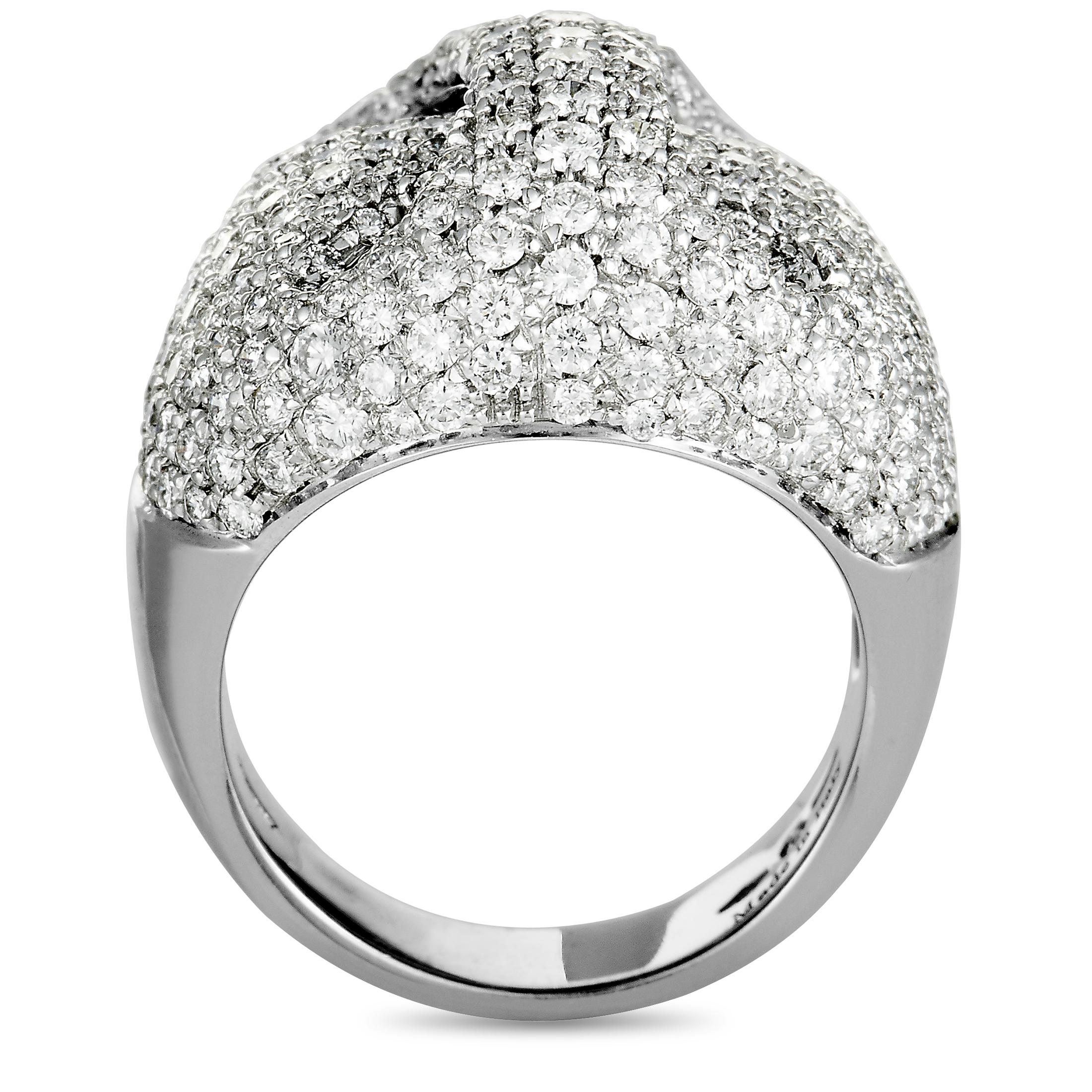The Damiani ring is made of 18K white and weighs 17 grams, boasting band thickness of 5 mm and top height of 9 mm, while top dimensions measure 23 by 21 mm. The ring is set with diamonds that weigh 3.21 carats in total.
 
 Offered in brand new