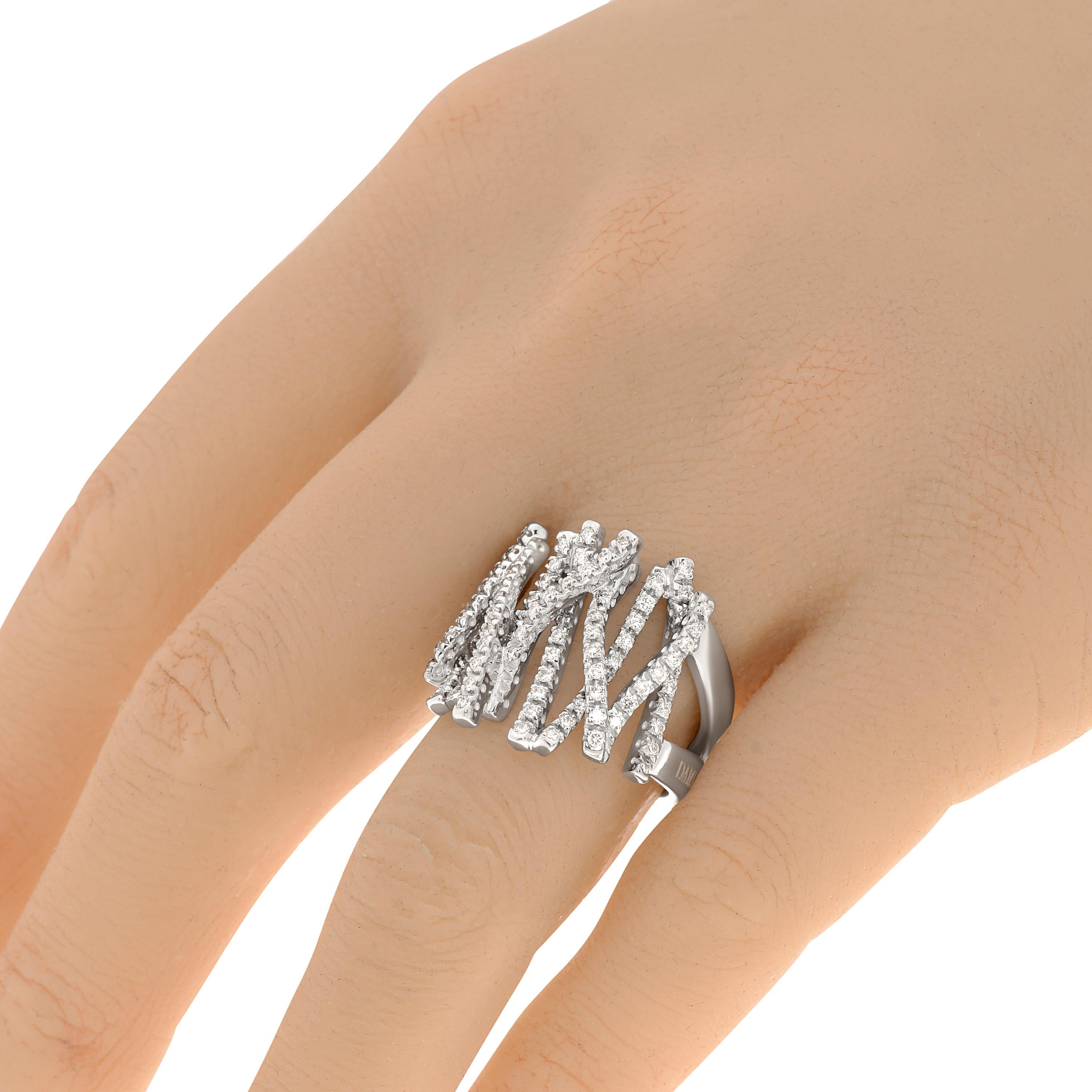 Damiani 18k white gold statement ring features 0.84ct. tw. diamond with color and clarity: FG, VVS/VS. The band width is 1/4
