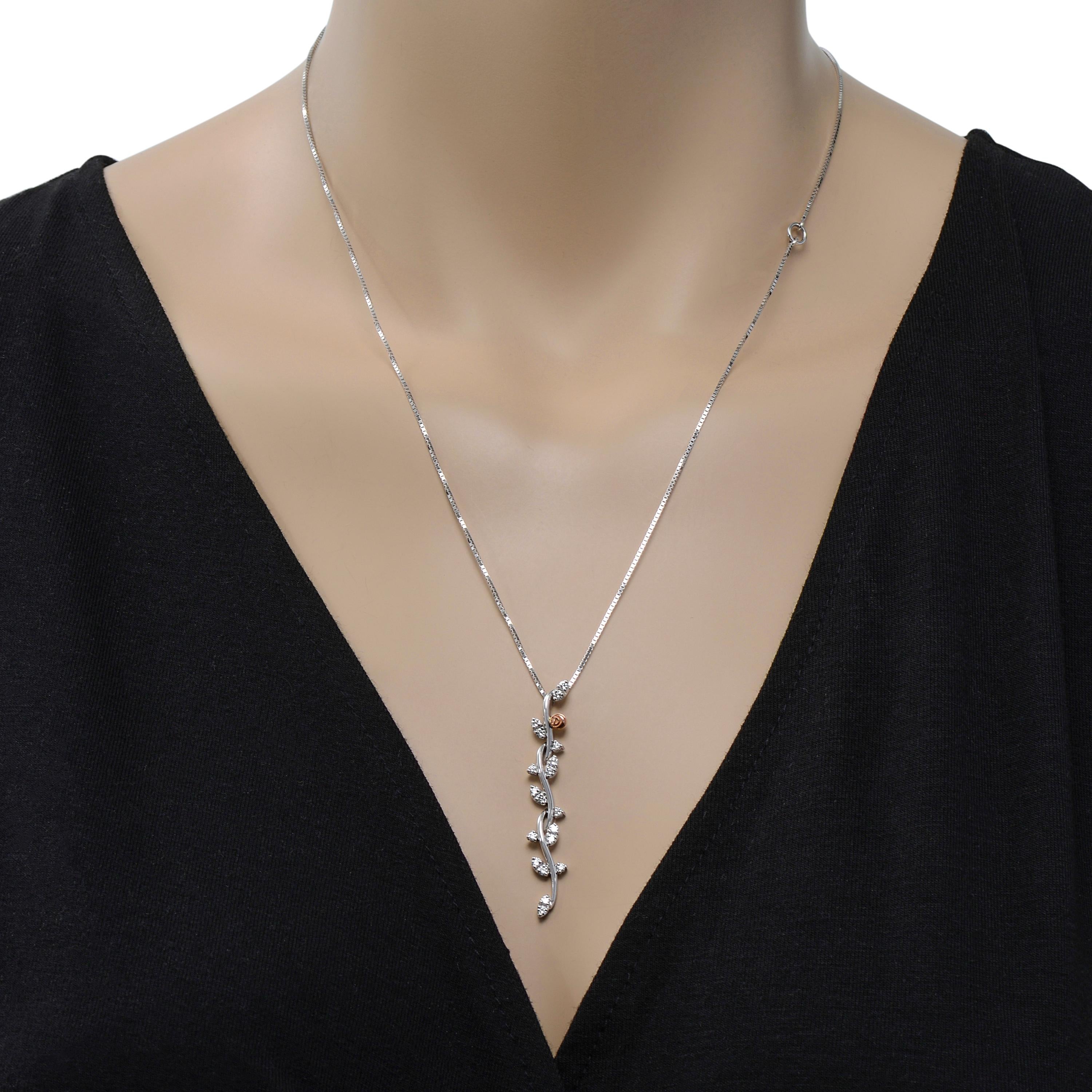 Damiani 18K white and rose gold bar necklace features 0.45ct. tw. round diamond petals with a rose gold Damiani rose. The decoration size is 1/4