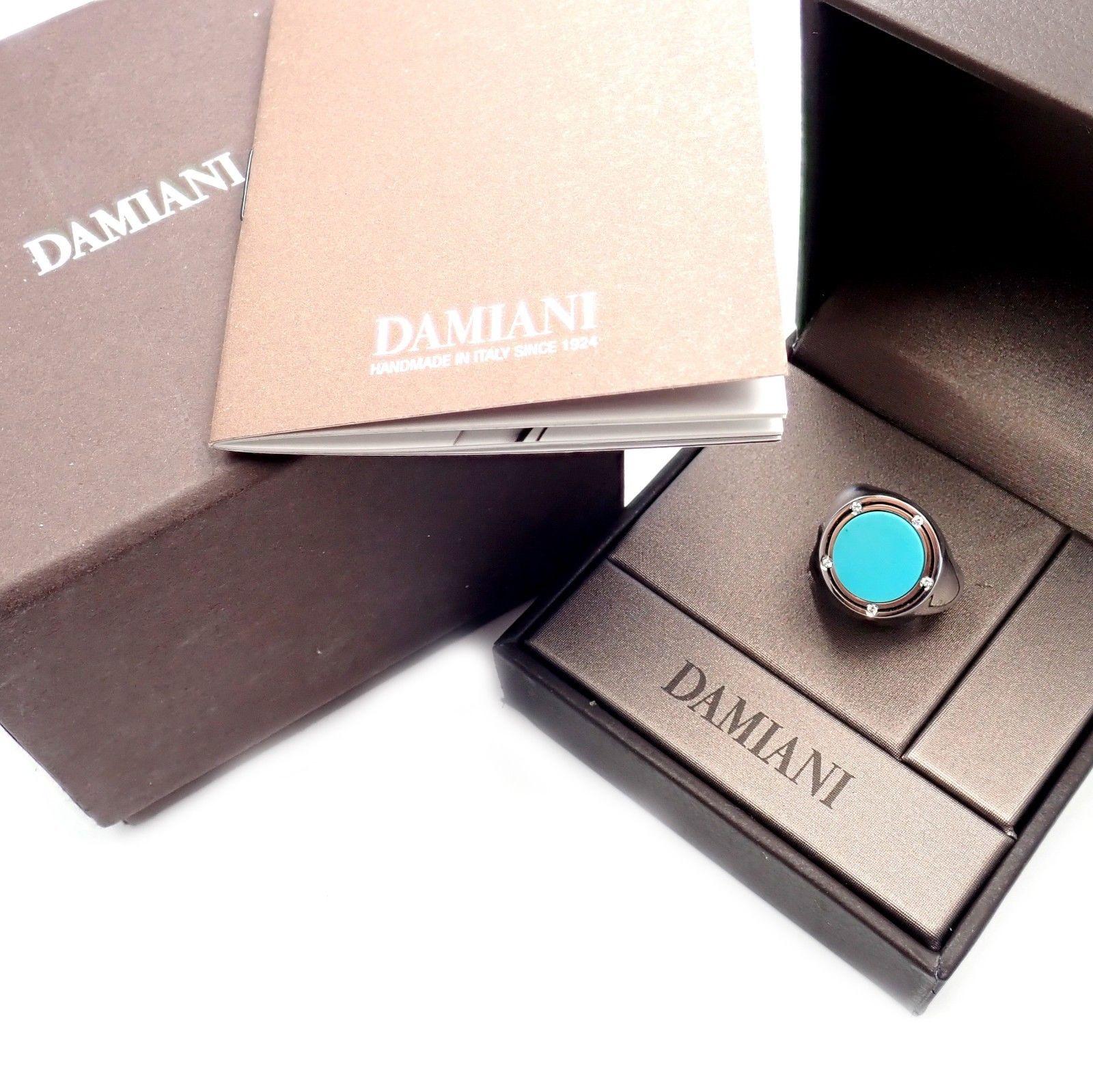 18k White Gold Diamond Black Turquoise Large Ring by Damiani co designed by Brad Pitt.
With 5 Round brilliant cut diamonds VS1 clarity, G color total weight approx. 0.05ct 1 large round Black Turquoise 3ct
This ring comes with Damiani Box and