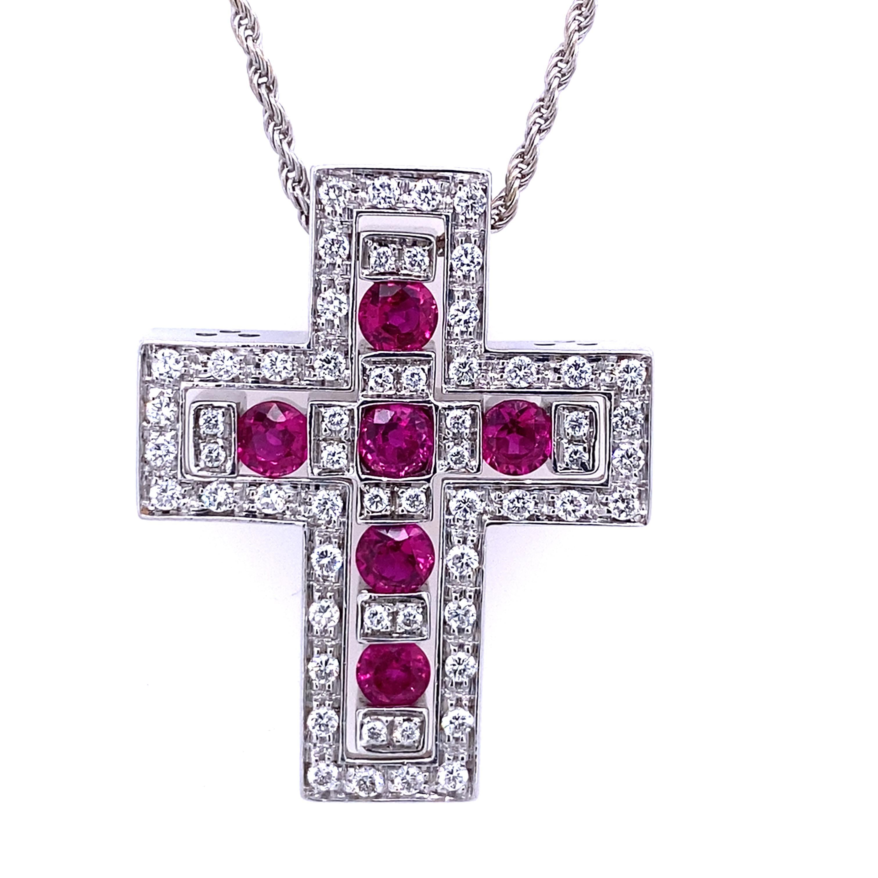 A stunning combination of a ruby cross pendant and a diamond cross pendant. The ruby cross pendant is set with six fine quality ruby gemstones, surrounded by diamonds and enhanced with 18ct white gold. The pendant is a symbol of faith, hope and