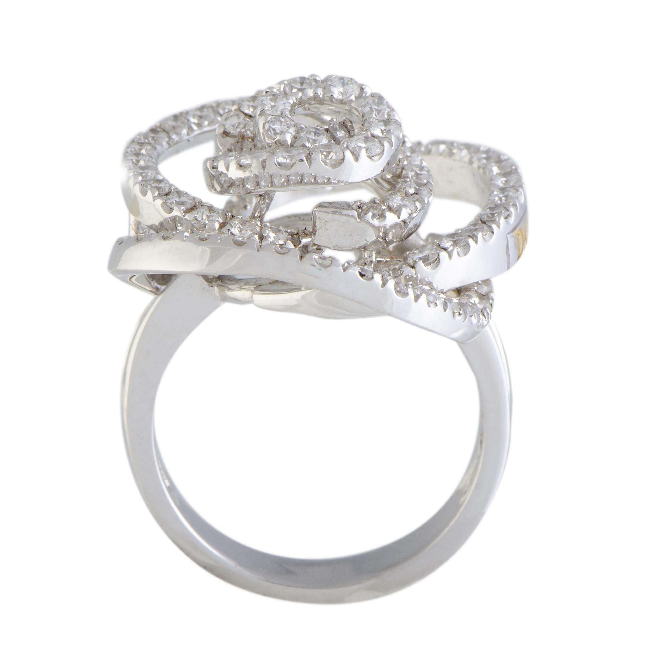 Remarkably designed in the shape of a rose, this perfect ring by Damiani is made to adorn your finger. Crafted in shimmering 18K white gold, the beautiful ring is embellished with 1.44ct of sparkling diamonds that enhance the aesthetic of the