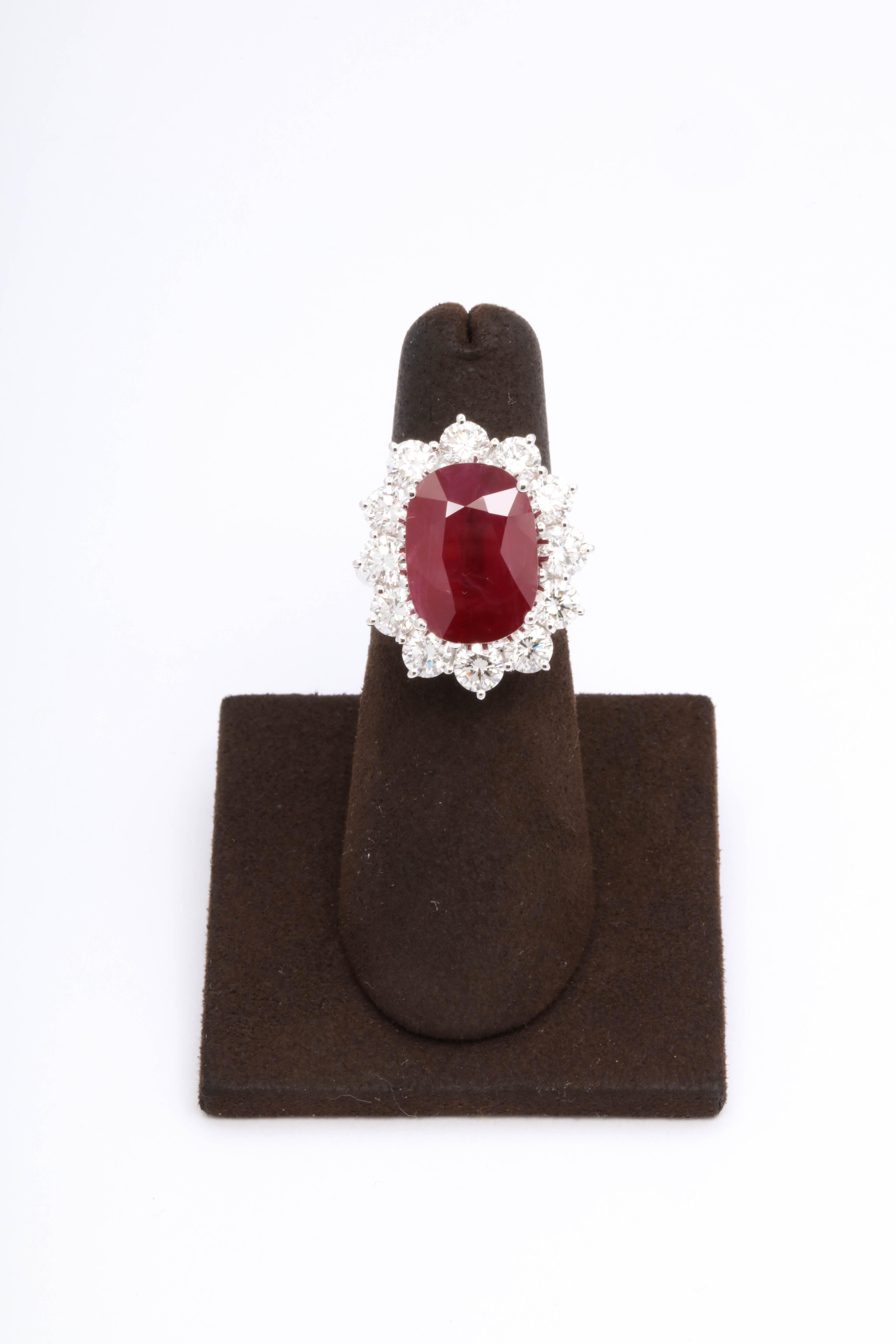 
A true collectors item -- made by famed Italian Jewelry Designer Damiani this ring is SPECTACULAR! 

Gorgeous 9.11 carat Fine Burma Ruby surrounded by 3.60 carats of white round brilliant cut diamonds set in 18k white gold 

The ring can be sized