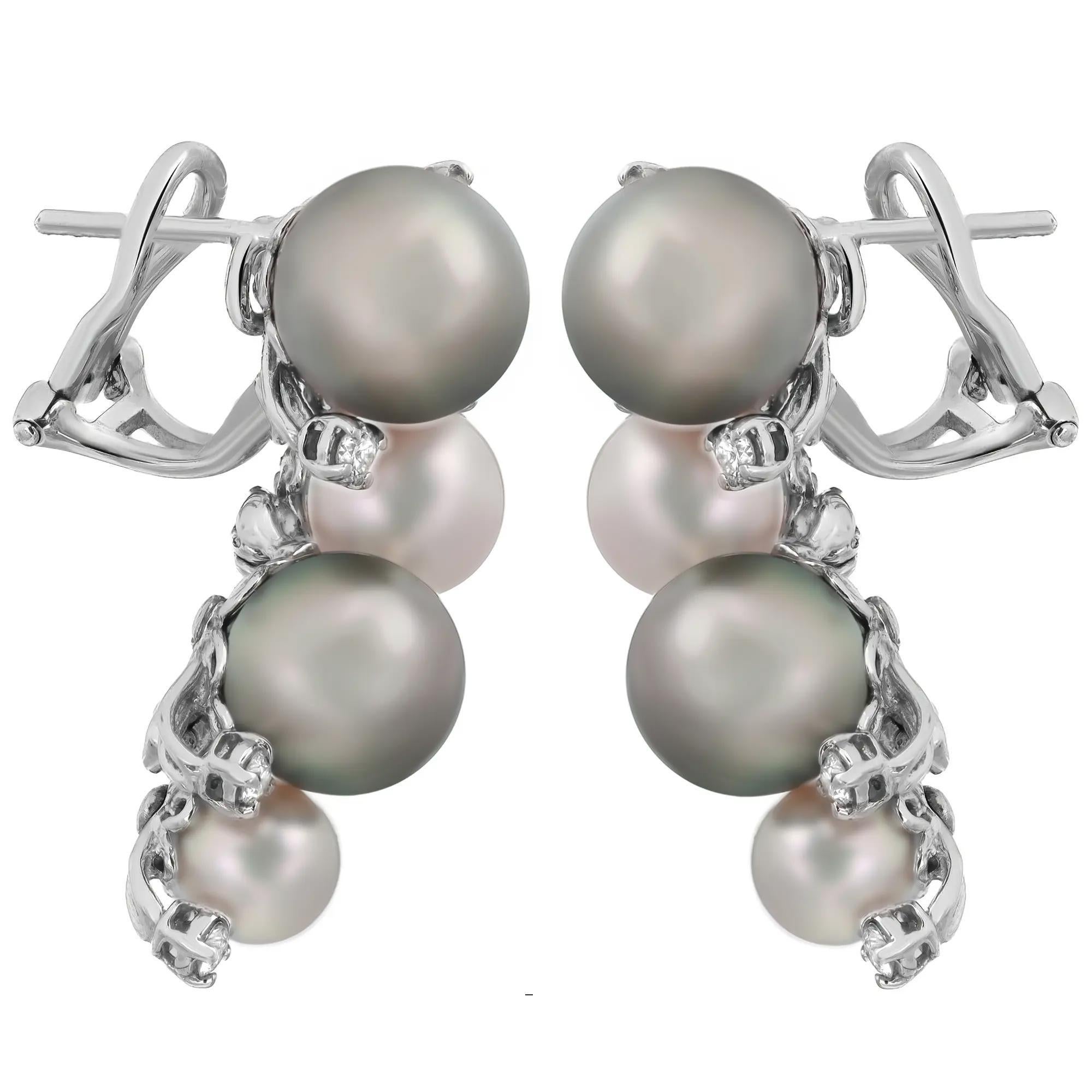 These wonderful pair of Damiani drop earrings are designed in lustrous 18K white gold studded with round brilliant cut diamonds and cultured river white and black pearls. Total diamond weight: 0.45 carat. Beautiful addition to you jewelry