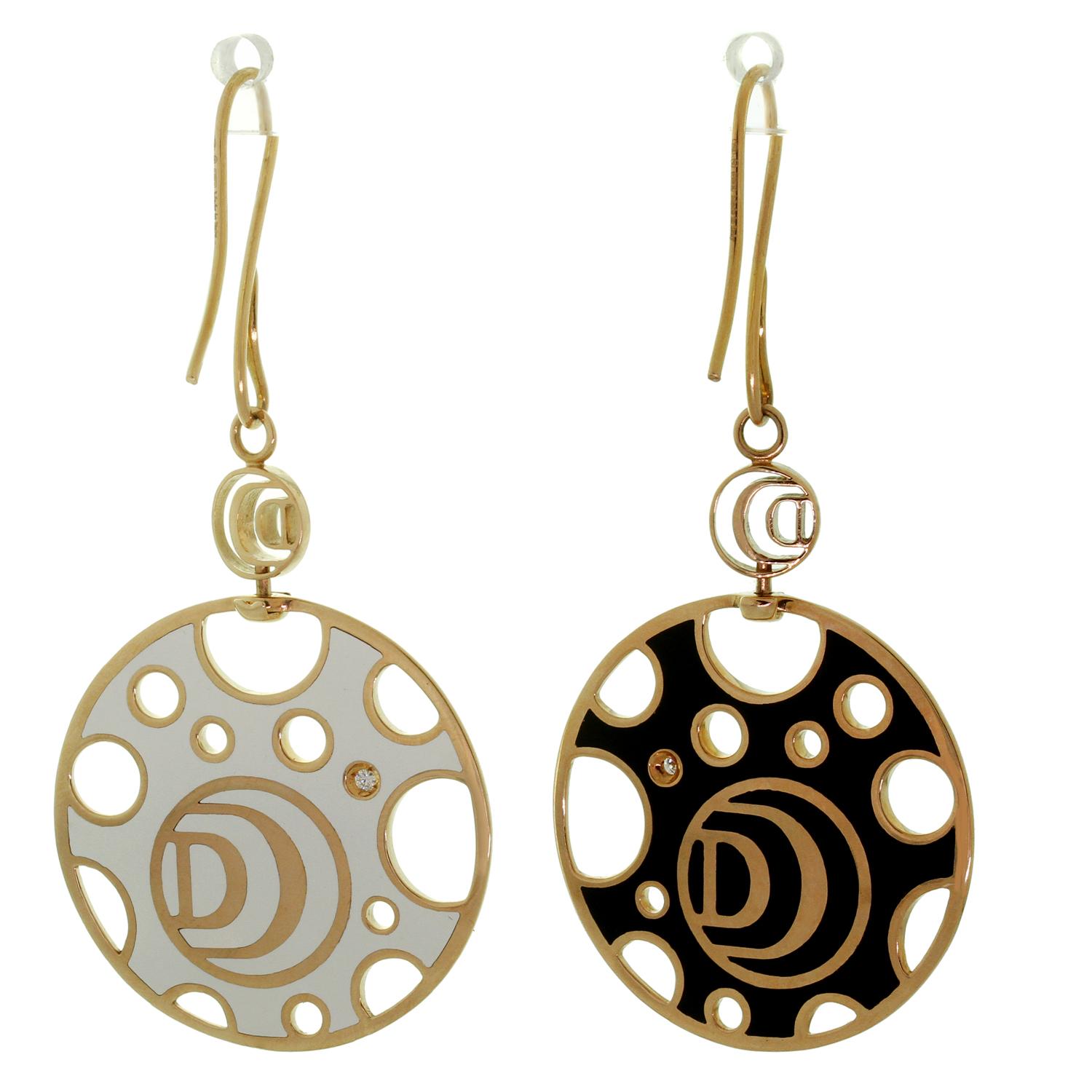 These gorgeous Damiani french wire drop earrings are crafted in 18k rose gold and feature versatile turnable large disks set with white enamel on one side and black enamel on the other side, completed with soliaire brilliant-cut round diamonds of an