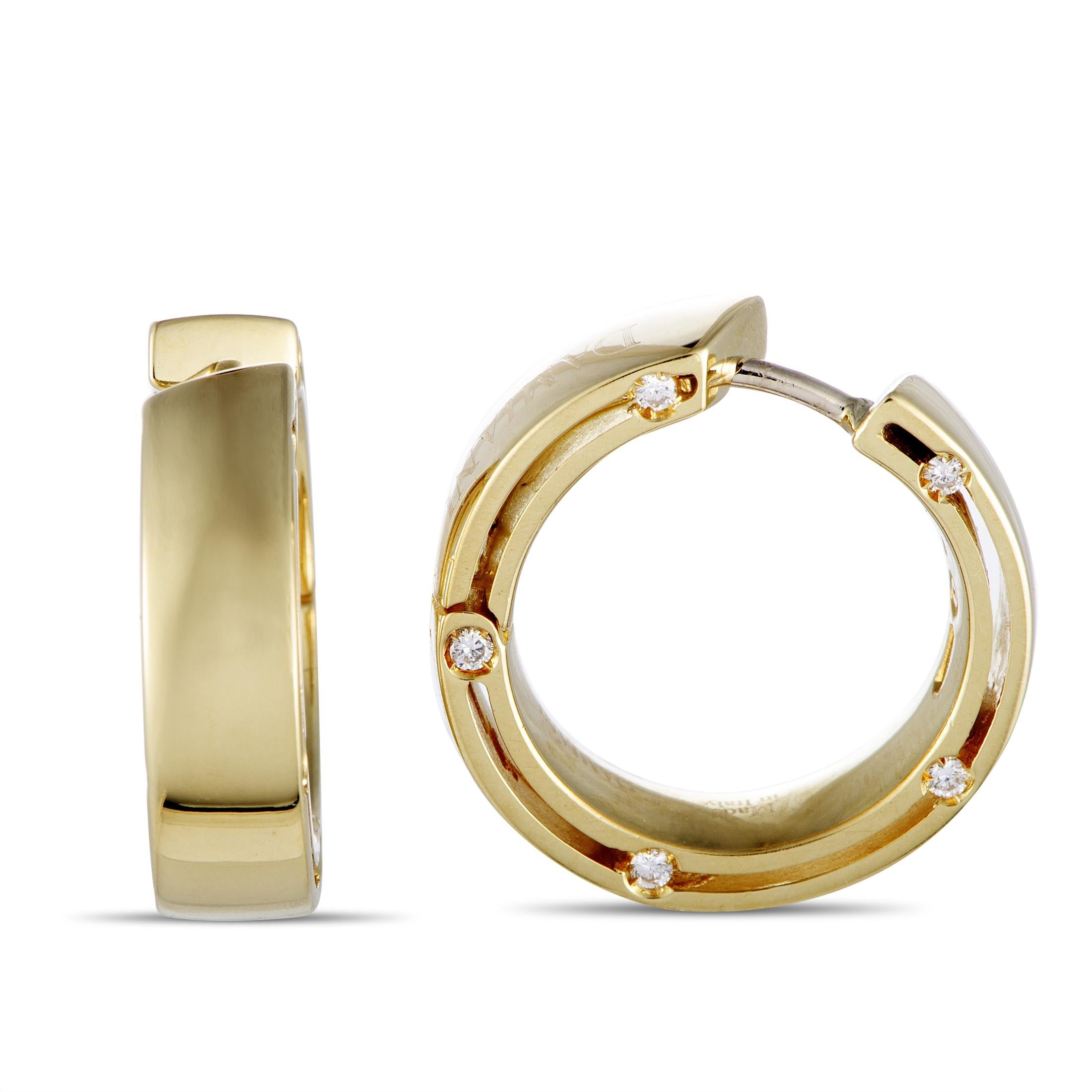 The Damiani “D.Side” earrings are crafted from 18K yellow gold and set with diamonds that weigh 0.16 carats in total. The earrings measure 0.65” in length and 0.25” in width, and each of the two weighs 5.15 grams.
 
 This pair of earrings is