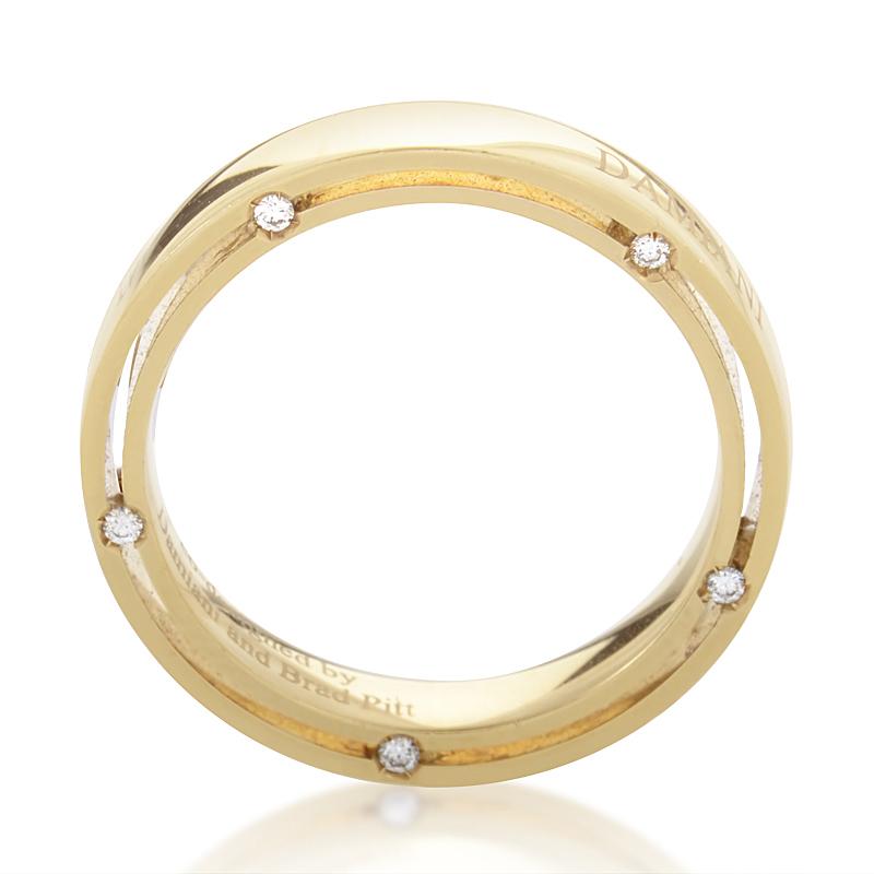 This gorgeous ring created by Brad Pitt and Damiani is custom designed to dazzle and delight. The ring is made of 18K yellow gold and is studded with ~.09ct of diamonds.
