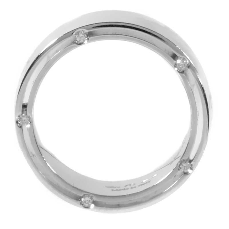 Damiani and movie star Brad Pitt joined forces to create this band ring with just the right touch of luxury. This band ring from the collection is made of 18K white gold and is studded with ~.09ct of diamonds.
