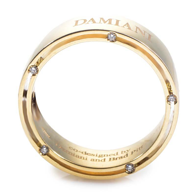 This band ring from Damiani has a wonderful design for men that is masculine with just a hint of sparkle for an additional air of luxury. The ring is made of 18K yellow gold and is studded with ~.09ct of diamonds.
