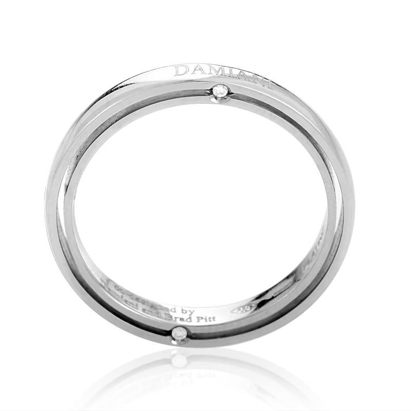 This simplistic band ring from Damiani has a classically elegant design perfect for a man or woman. The ring is made of 18K white gold and is studded with ~.03ct of diamonds.
Ring Size: 8.0