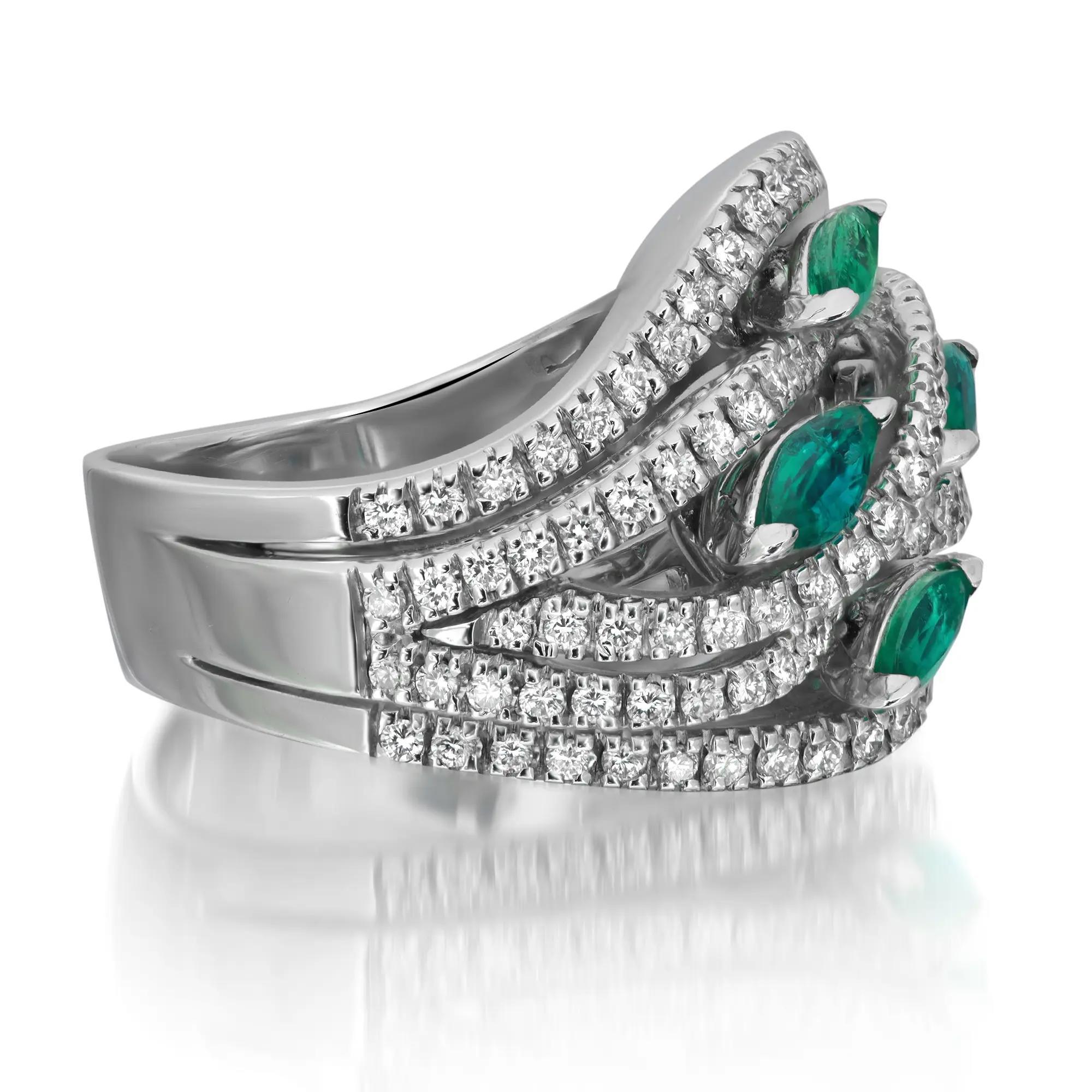 This Damiani cocktail ring, crafted in 18K white gold, features dazzling round-cut white diamonds totaling 0.95 carats. It is also set with four marquise-cut emeralds totaling 0.70 carats in a prong setting. The ring size is 7.5 and it weighs a