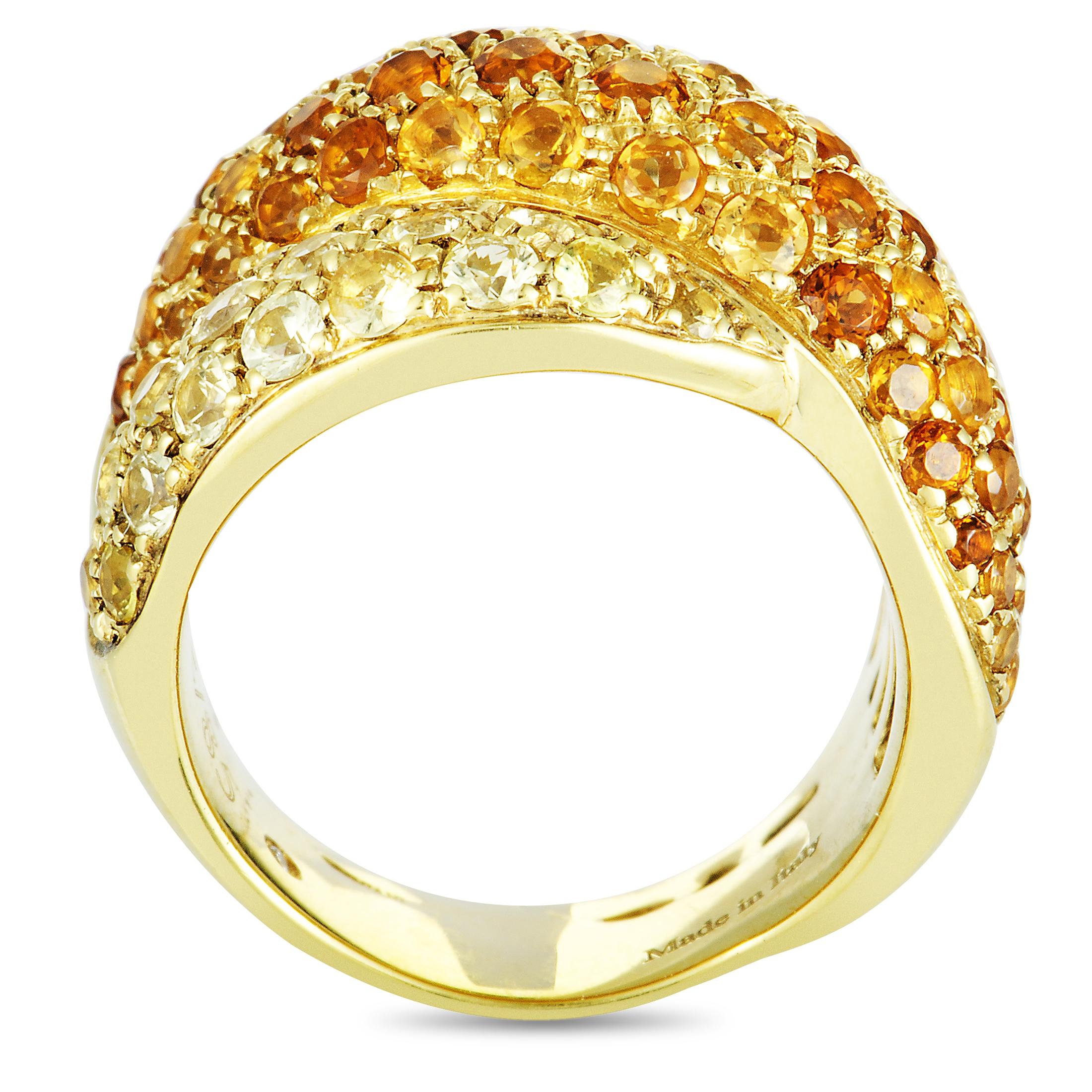The Damiani “Gomitolo” ring is made of 18K white and weighs 15.6 grams, boasting band thickness of 8 mm and top height of 7 mm, while top dimensions measure 23 by 17 mm. The ring is set with yellow sapphires that weigh 4.20 carats, and citrine that
