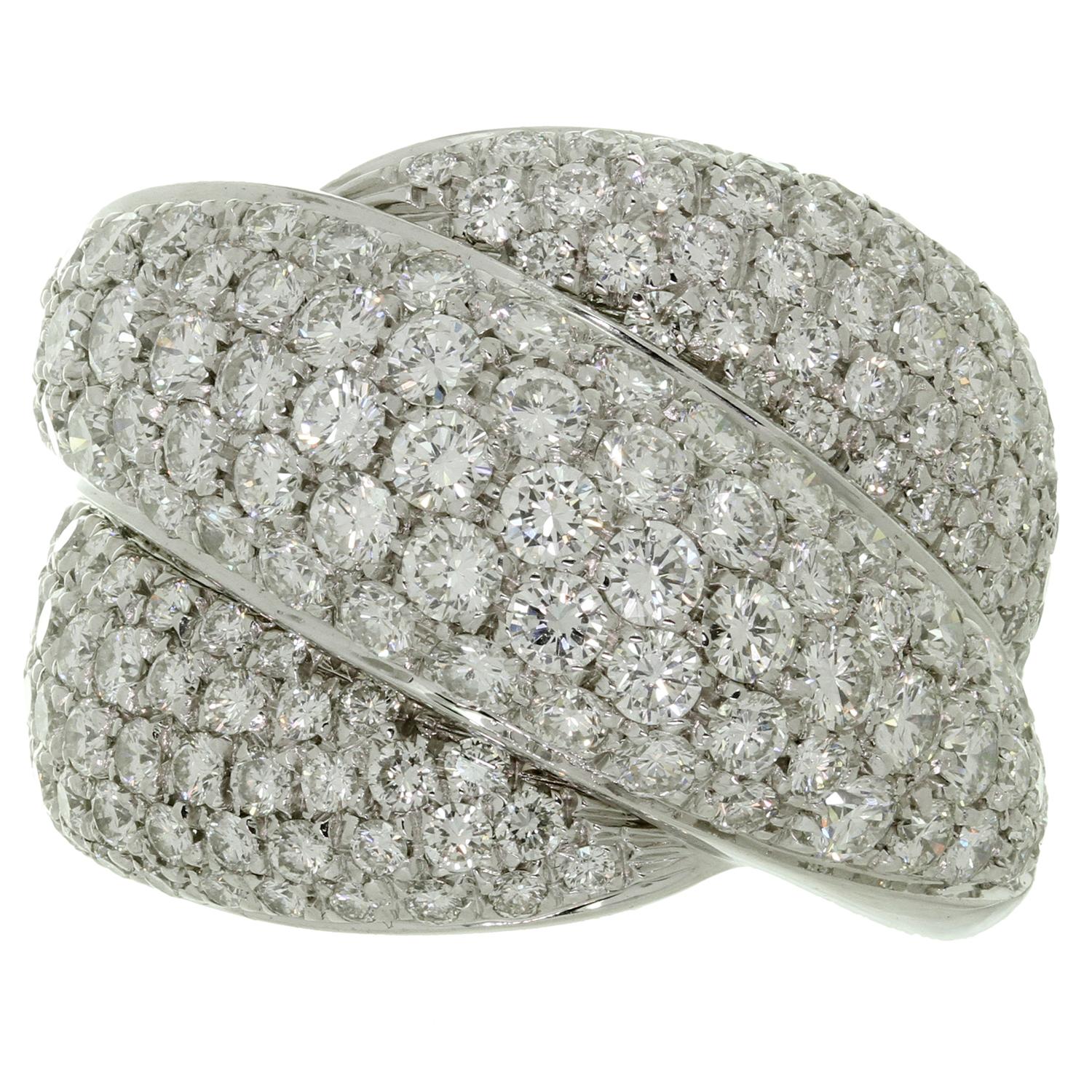 This stunning Damiani ring from the classic Gomitolo collection features a sparkling entwined band design crafted in 18k white gold and pave set with brilliant-cut round F-G VVS2-VS1 diamonds weighing an estimated 5.0 carats. Made in Italy circa