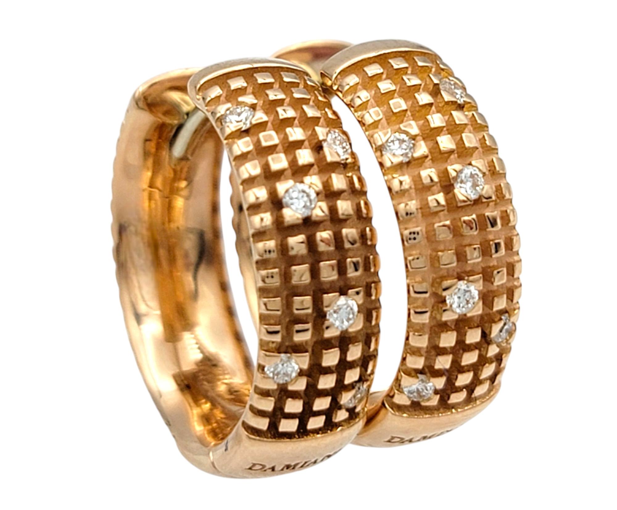 Elevated with subtle brilliance and bold Italian design, these authentic Damiani Metropolitan hoop earrings are a refined expression of luxury. Crafted in 18 karat rose gold, the hoops feature a distinctive open grid pattern that adds texture and
