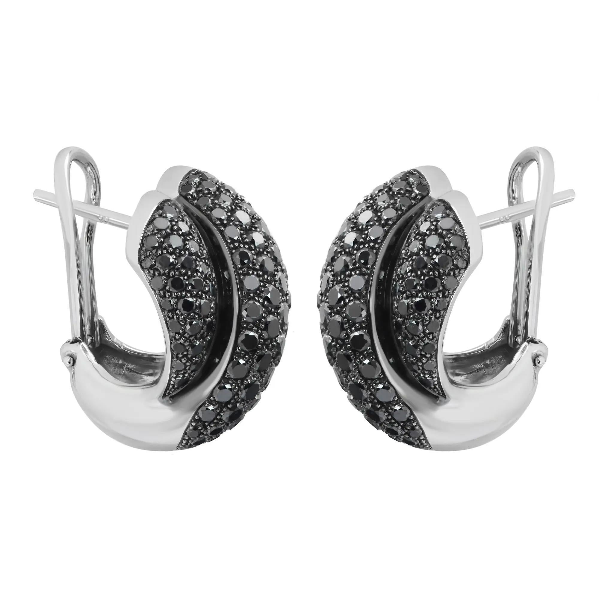 These glamorous black diamond huggie earrings feature pave set round brilliant cut black diamonds weighing 4.76 carats. Encrusted in lustrous 18K white gold. Earring length: 19.5mm. Width: 15.5mm. Total weight: 17 grams. Secured with omega back