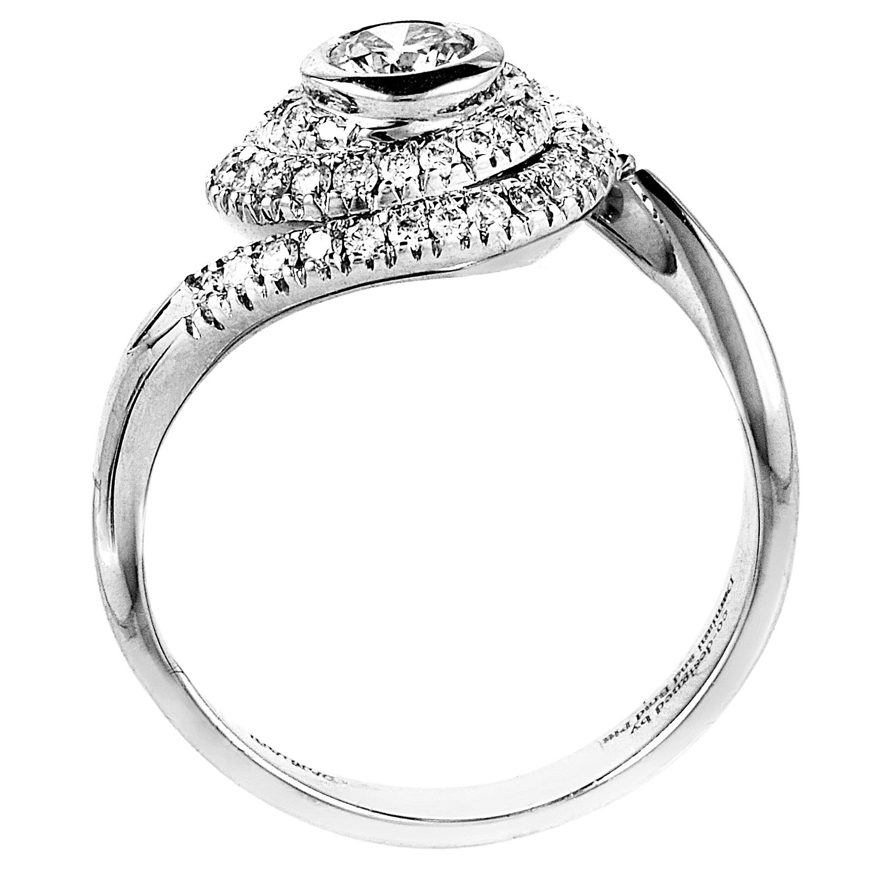 This engagement ring from Damiani has a refreshingly original look that is perfect for the lady that likes to stand out. It is made of 18K white gold and is set with ~.71ct of diamonds.
