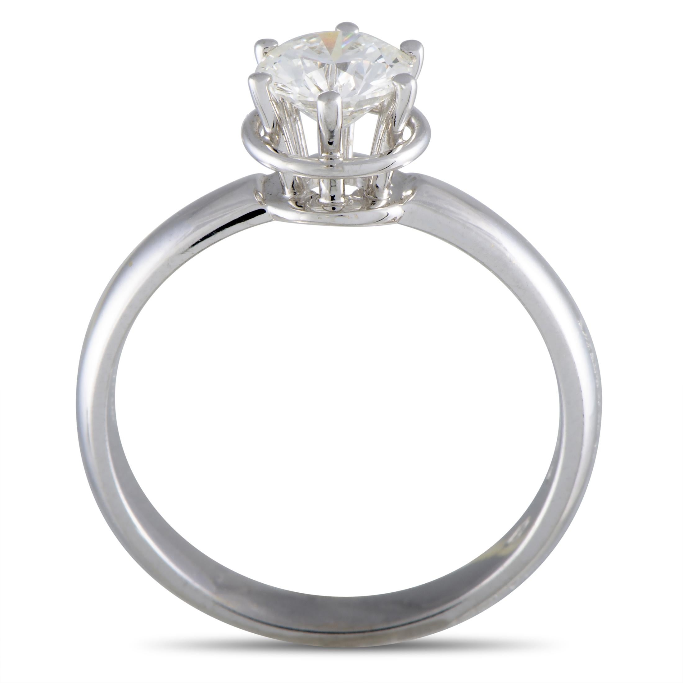 The Damiani “Queen” engagement ring is crafted from 18K white gold and weighs 3.9 grams. It has band thickness of 3 mm and top height of 6 mm, while top dimensions measure 7 by 7 mm. The ring is set with a diamond stone that weighs 0.75 carats.
 

