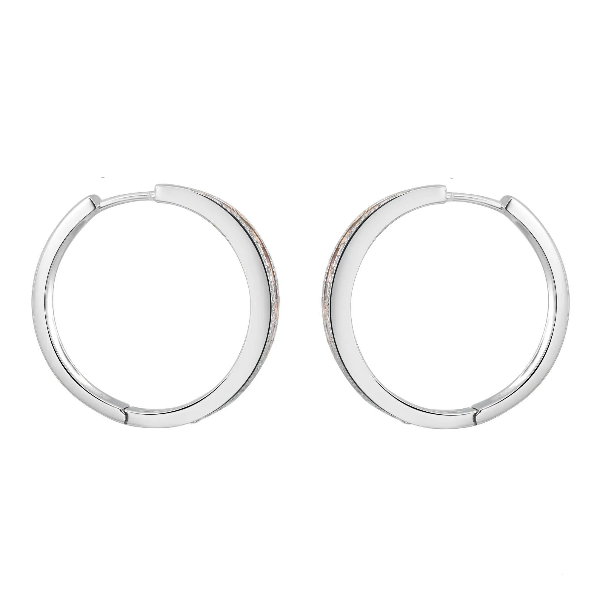 These beautiful h00p earrings feature three rows of pave set round cut diamonds with two rows crafted in 18K white gold and center row in 18K rose gold. Total diamond weight: 1.27 carats. Diamond color G-H and clarity VS-SI. Earring length: 23.6 mm.