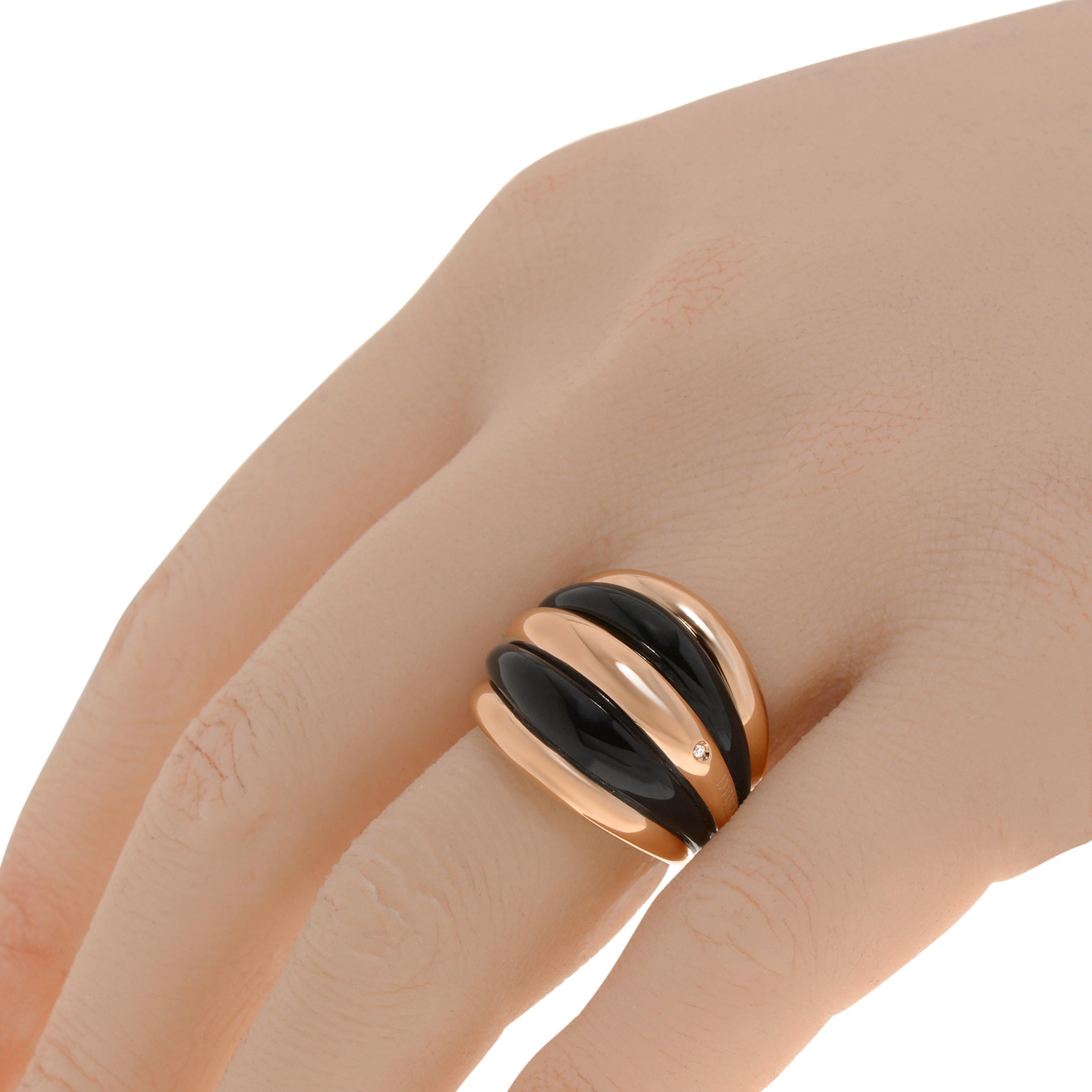 Damiani 18K rose gold statement ring features layered black onyx with an approximately 0.01ct. tw. diamond accent. The ring size is 5 (49.3). The band width is 3/4