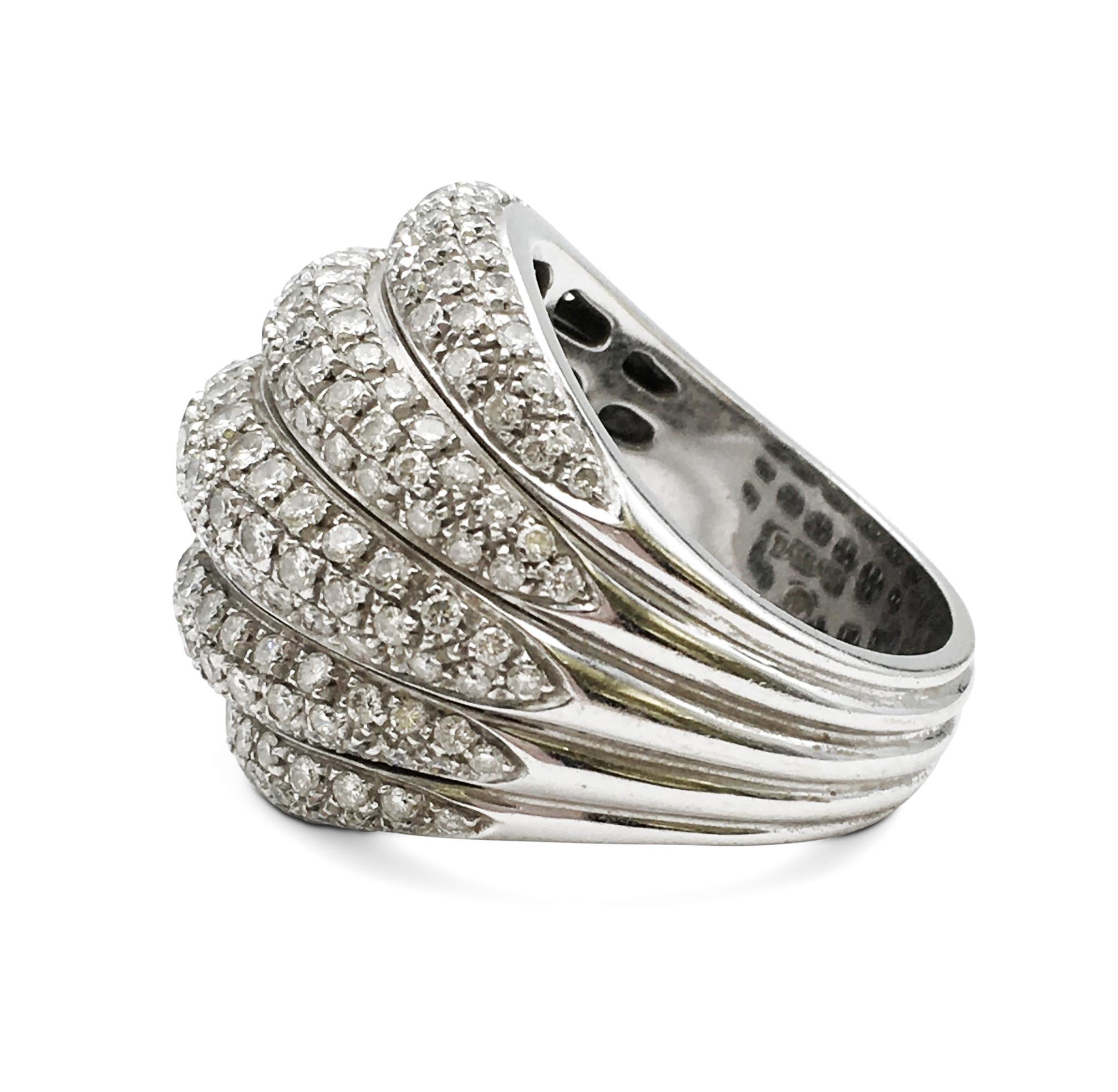 Authentic Damiani dome-shaped cocktail ring crafted in 18 karat white gold featuring 5 rows of high-quality round brilliant cut diamonds weighing an estimated 3.75 carats of round brilliant cut diamonds. Signed Damiani, 750, with serial number. Ring