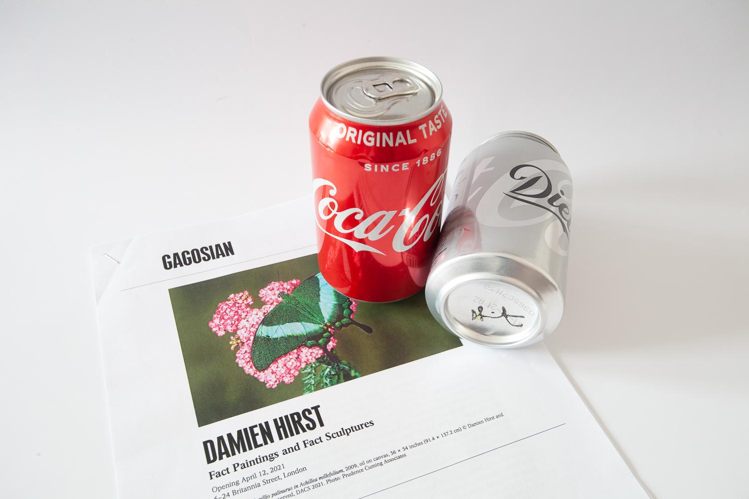 Hand Signed Complete set of Damien Hirst Coca-Cola and Diet Coca-Cola limited edition cans, part of Hirsts Fact Sculpture work Coke/Diet Coke Vending machine, 2007.

Both cans Unopened. As New. These cans where dispensed for a time limited period