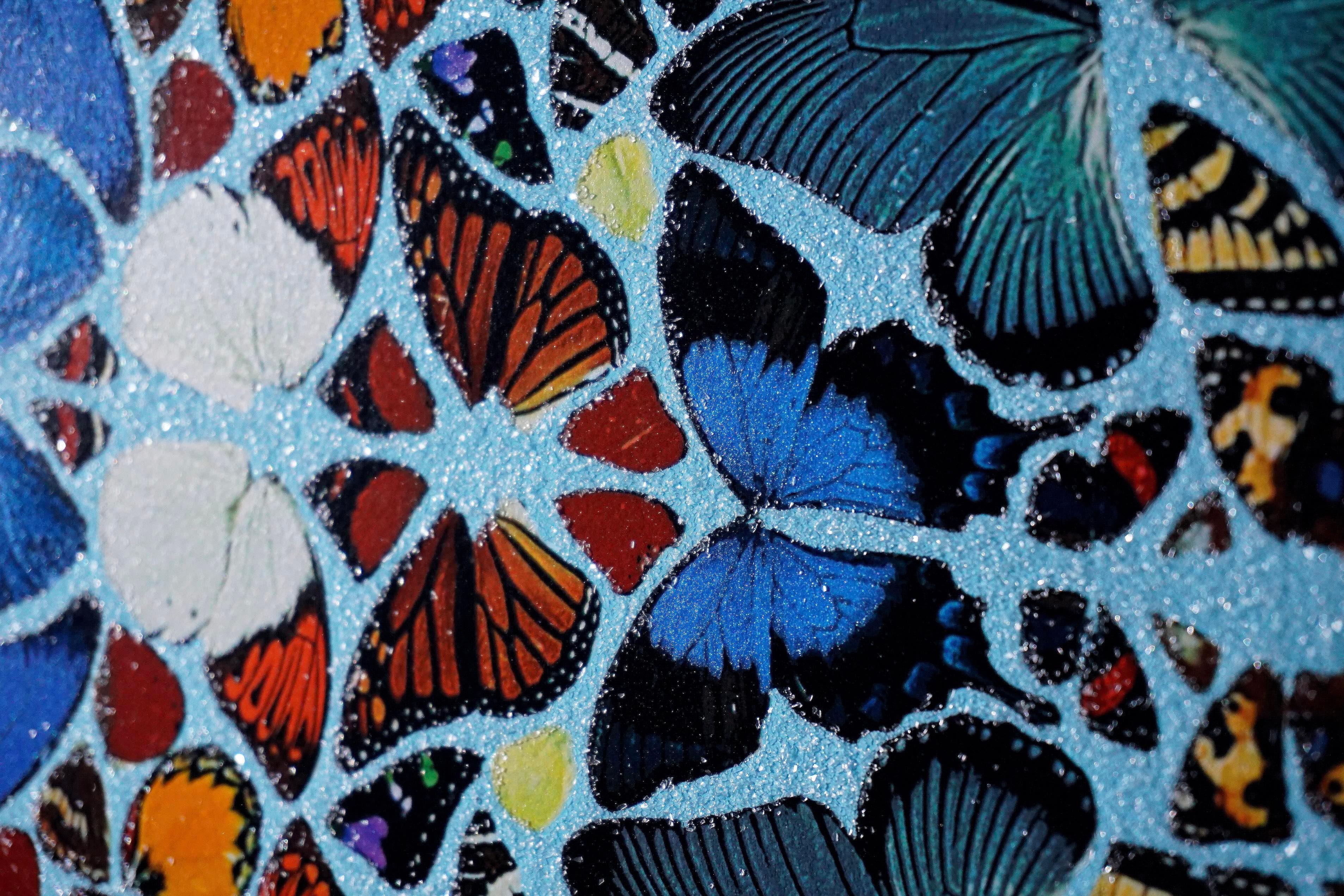 The grand ‘Mantra' butterfly wing kaleidoscope mandala with diamond dust by contemporary master artist, Damien Hirst, was created in 2011. The large-scale glittering artwork is a silkscreen print with layers of genuine diamond dust and is the